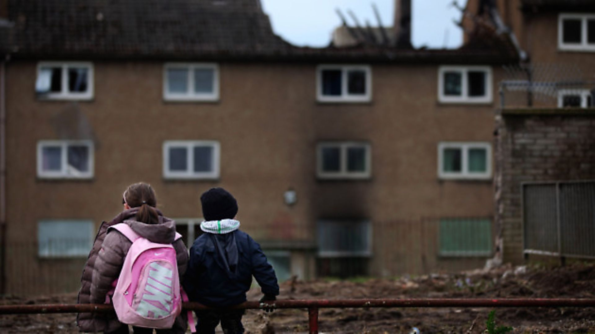 Children make their way home from school in the Easterhouse housing estate in Glasgow, 2010. - Credit: Getty Images
