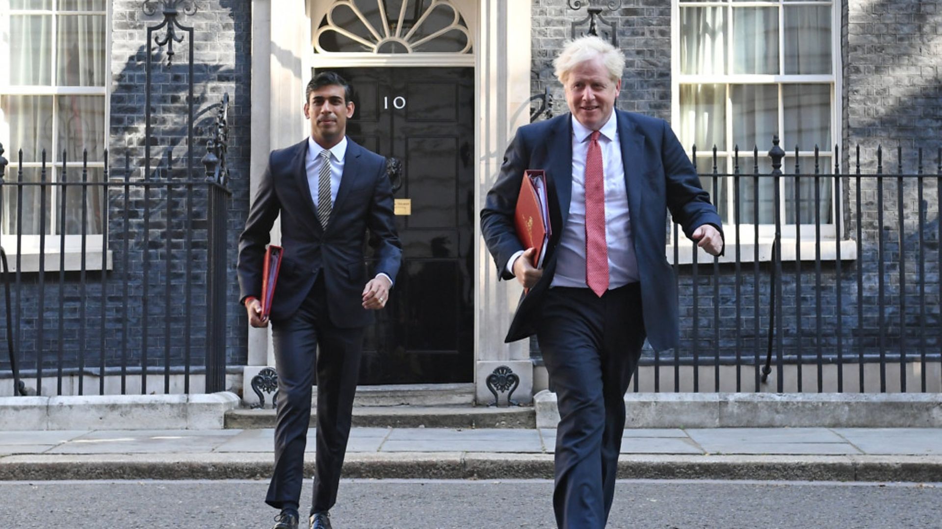 Chancellor Rishi Sunak (L) and prime minister Boris Johnson leave 10 Downing Street - Credit: Stefan Rousseau/PA