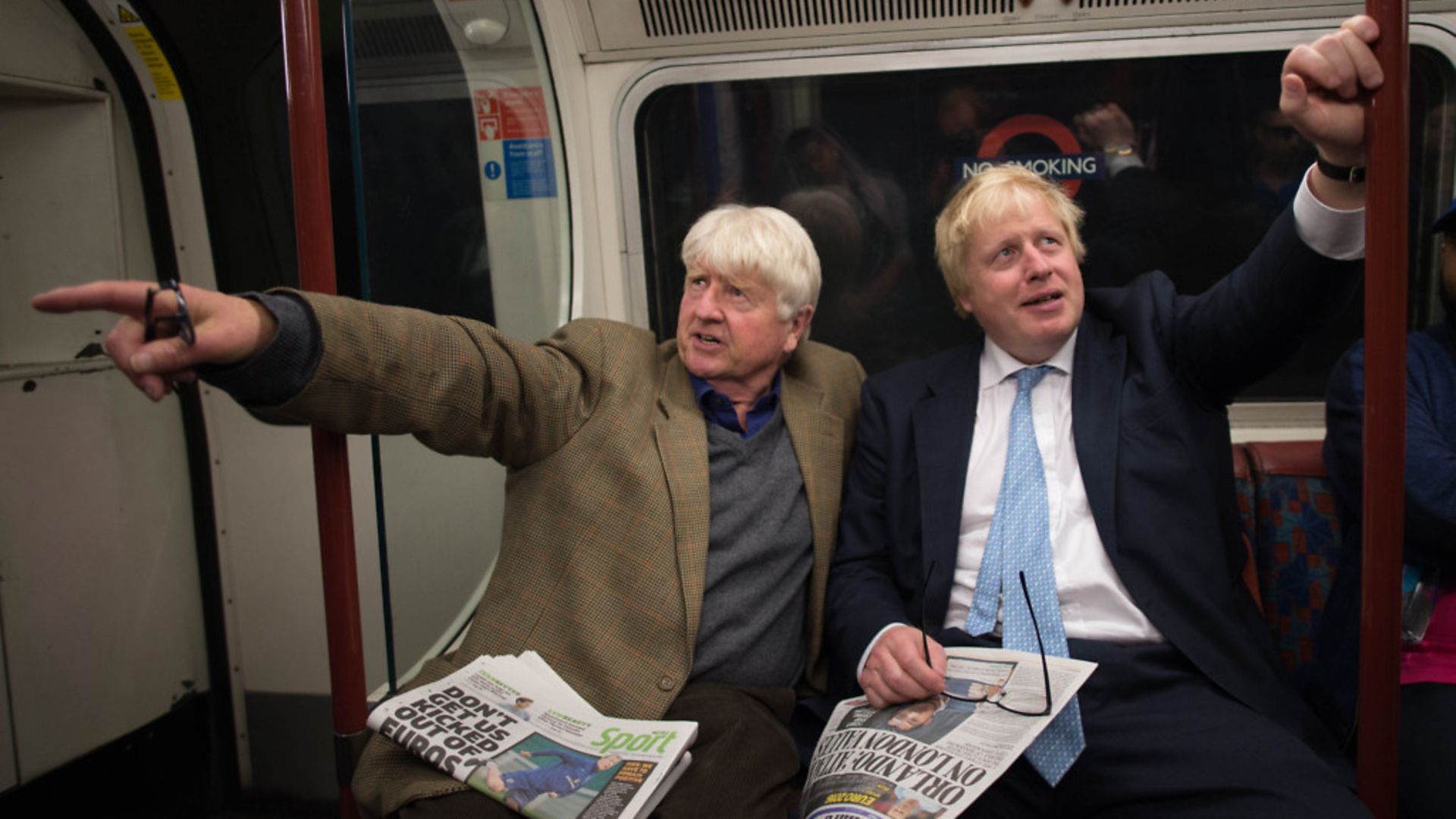 Boris Johnson sits next to his father Stanley (left) on the Bakerloo Line while mayor of London - Credit: Stefan Rousseau/PA
