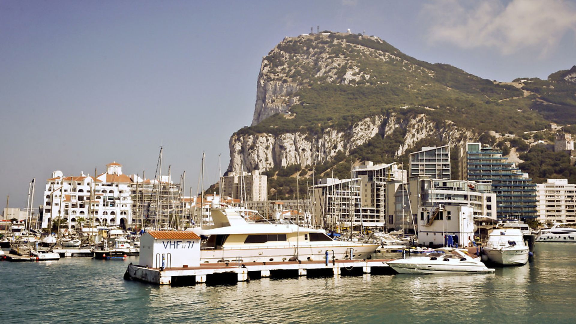 A general view of buildings and the marina in front of the Rock of Gibraltar. - Credit: PA