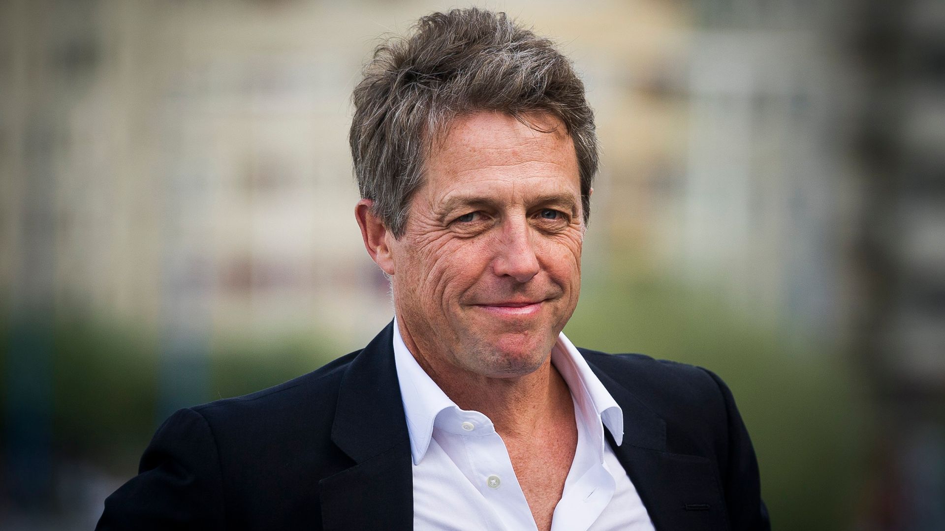 Hugh Grant attends a photocall for 'Florence Foster Jenkins (2016)' at the San Sebastian Film Festival - Credit: Getty Images