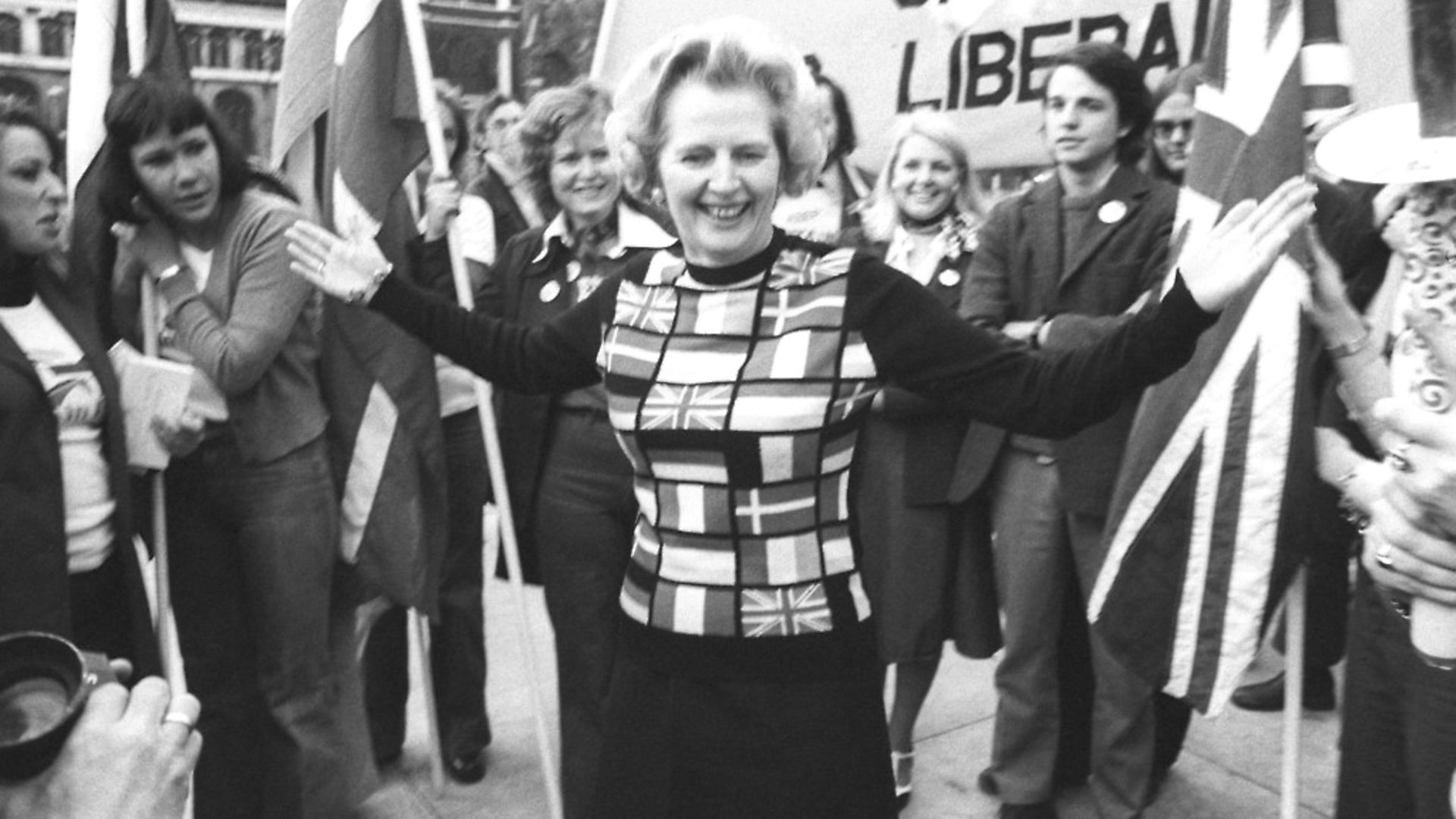 Margaret Thatcher, sporting a sweater bearing the flags of European nations, in Parliament Square during her 'Yes to Europe' campaign. Photograph: PA Archive. - Credit: PA Archive/PA Images