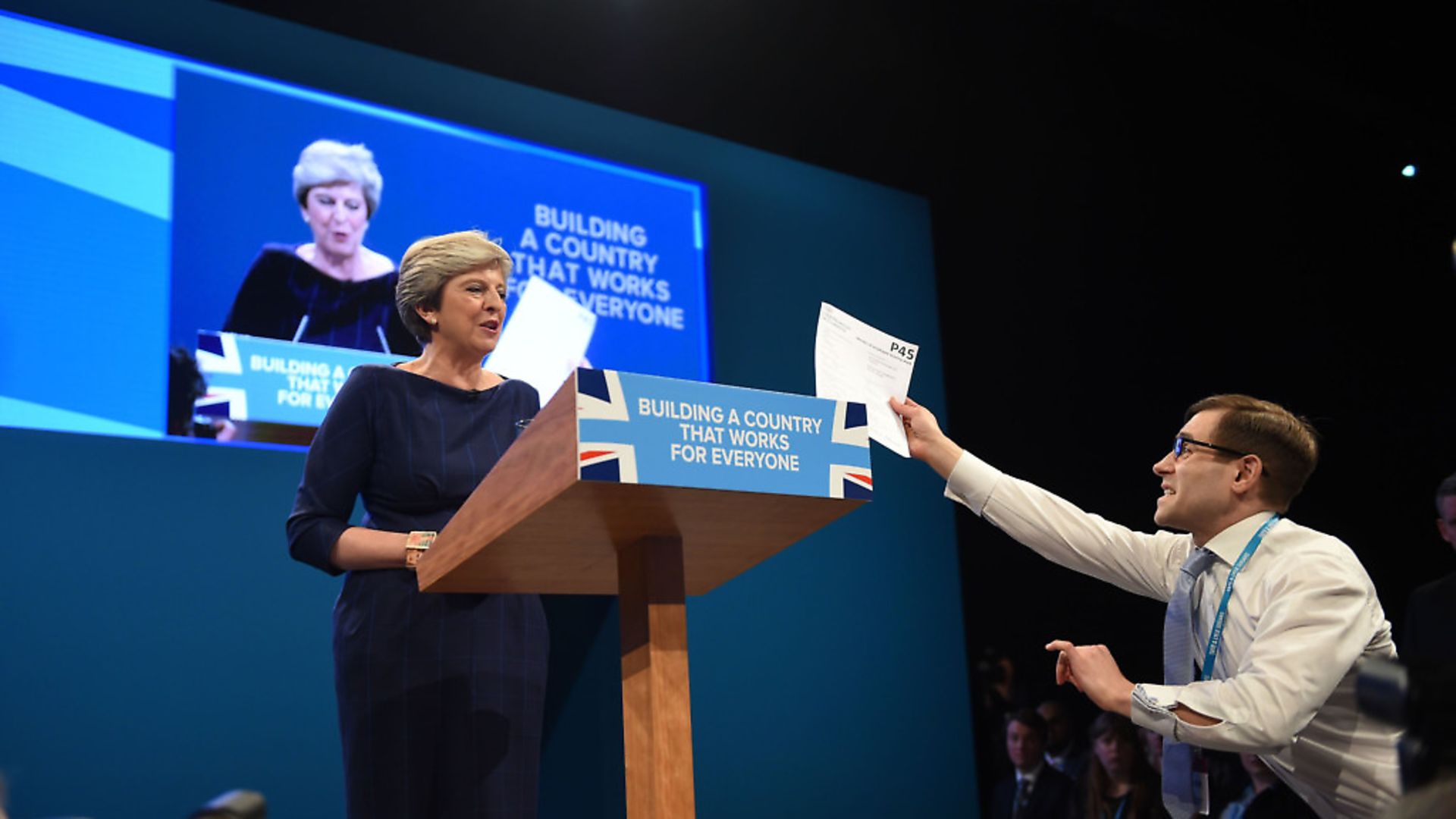 Comedian Simon Brodkin, also known as Lee Nelson confronts Prime Minister Theresa May with her 'P45'. Photograph: Peter Byrne/PA. - Credit: PA Wire/PA Images