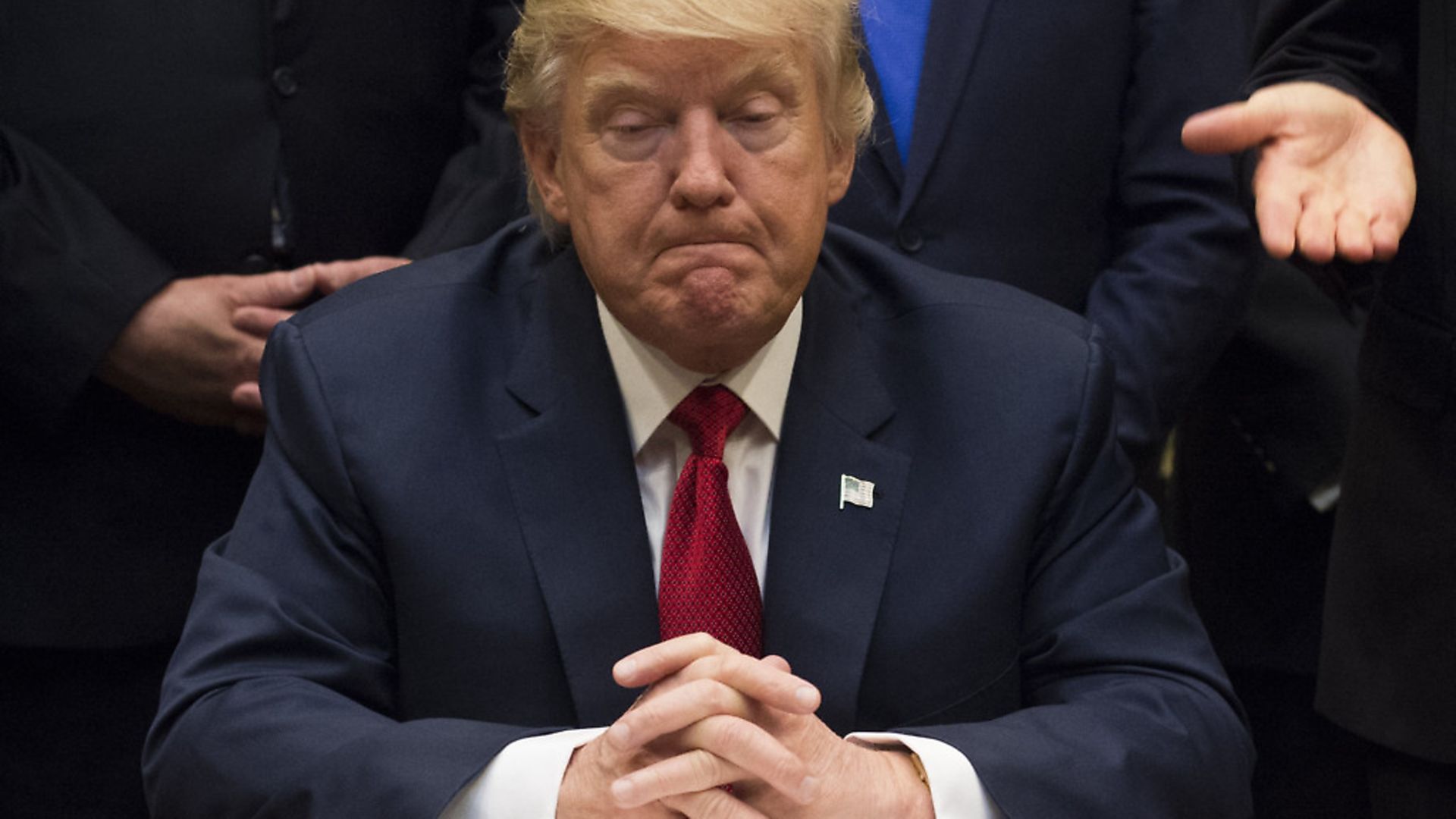 United States President Donald Trump listens after signing the S. 544 the Veterans Choice Program Extension and Improvement Act in the Roosevelt Room at the White House in Washington, DC on April 19, 2017. Photo: Molly Riley/Consolidated/Pool/dpa - Credit: DPA/PA Images