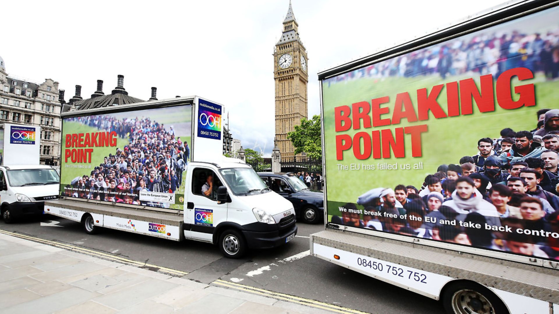 Vans showing the new Ukip EU referendum poster drive past Big Ben in London, for the launch of the poster campaign with Ukip leader Nigel Farage. - Credit: PA Archive/PA Images