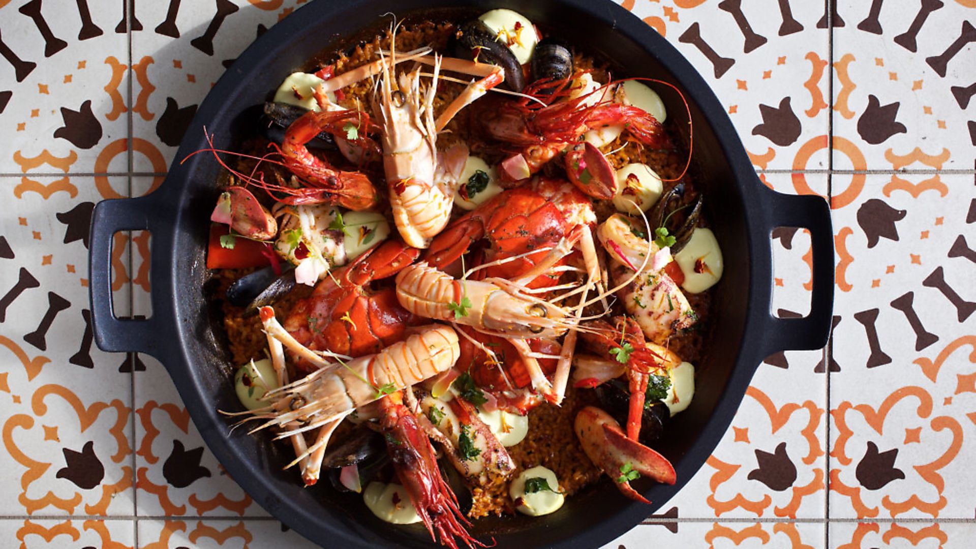 Paella de Pescados y Mariscos - Maine Lobster, Carabineros, Langoustines, Pink Key West Shrimp, Wild Calamari, PEI Mussels at Del Mar on the DC Wharf photographed in Washington, DC. (Photo by Deb Lindsey For The Washington Post via Getty Images). - Credit: The Washington Post/Getty Images