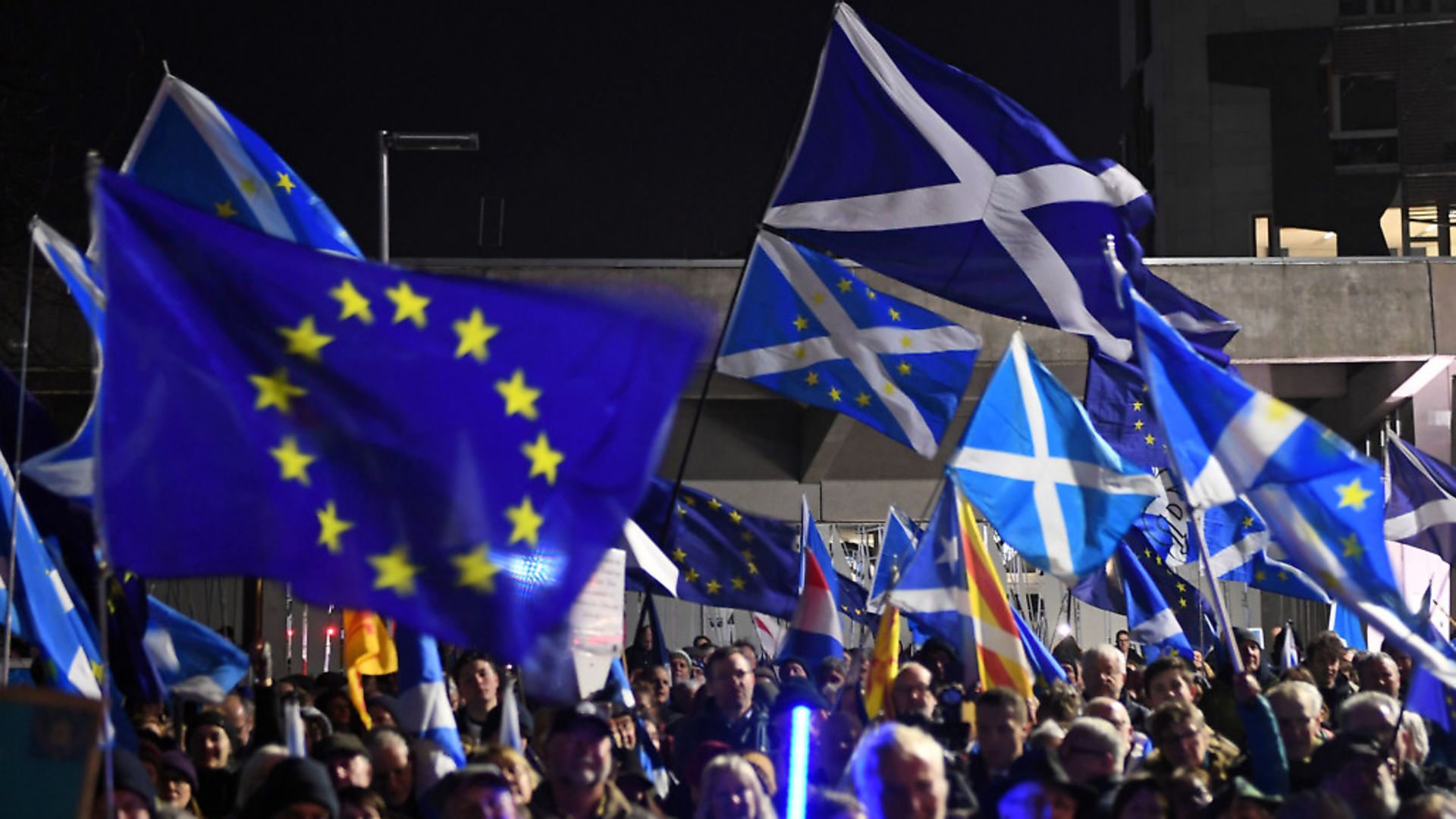 Saltires and European Union flags flutter in the breeze during a protest by anti-Brexit activists in Edinburgh, Scotland on January 31, 2020. Photo: ANDY BUCHANAN/AFP via Getty Images - Credit: AFP via Getty Images
