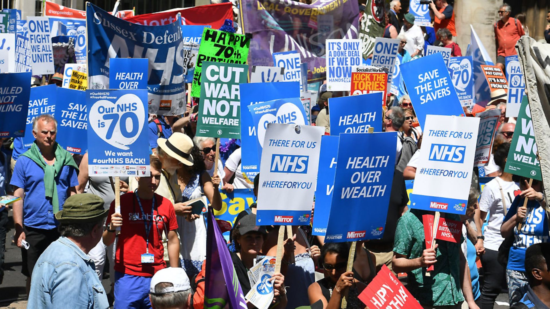 People marching to celebrate the 70th anniversary of the NHS. Picture: John Stillwell/PA - Credit: PA Wire/PA Images
