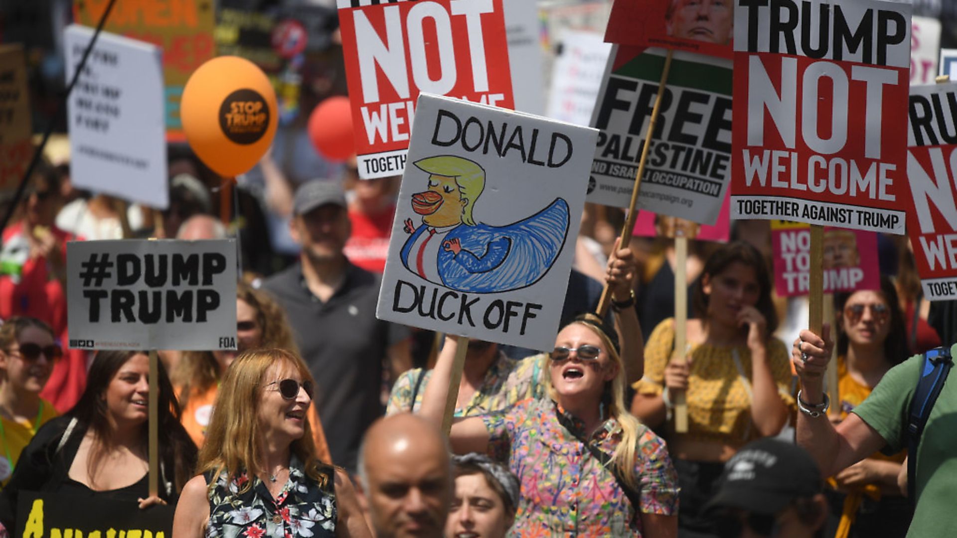 Protesters for the 'Stop Trump' Women's March pass along Whitehall in London, as part of the protests against the visit of US President Donald Trump to the UK. Photograph: Victoria Jones/PA. - Credit: PA Wire/PA Images