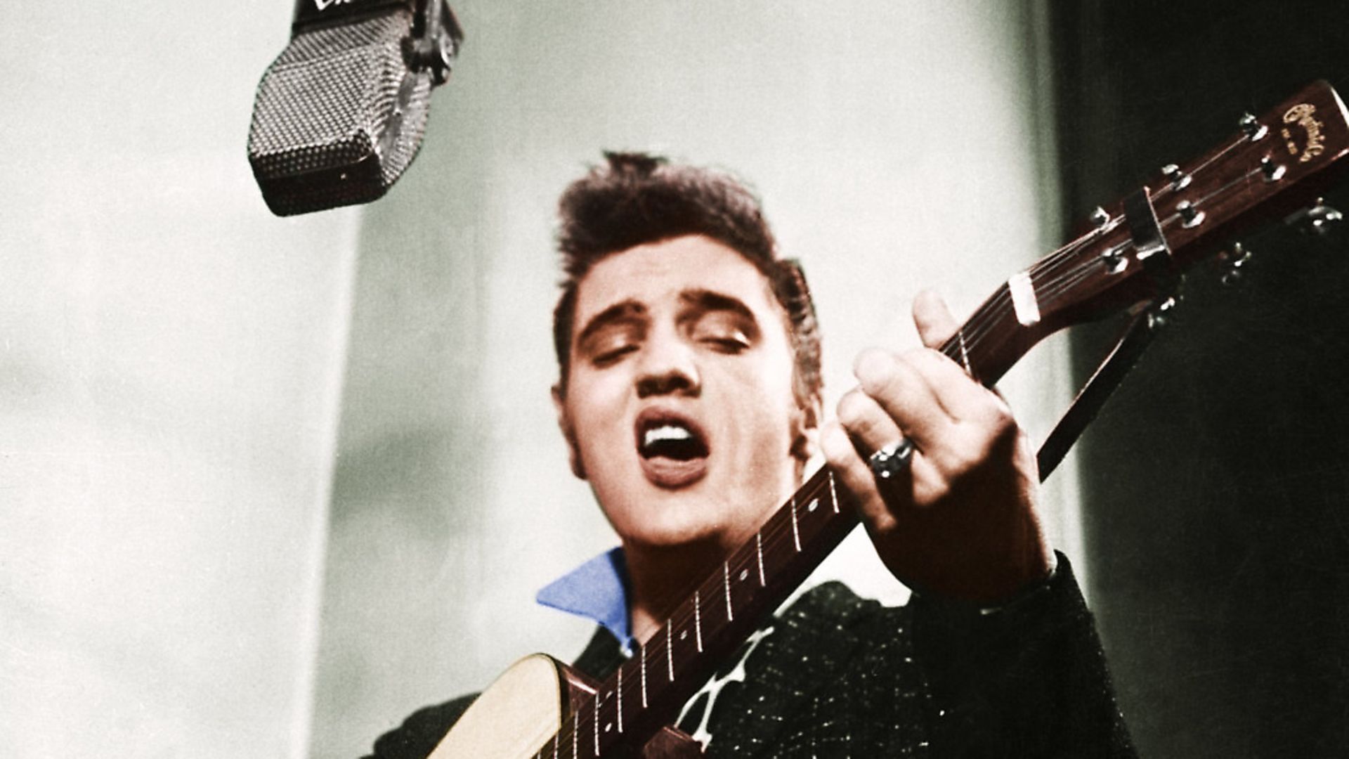 Elvis Presley playing guitar. Photo: Bettmann/Getty Images - Credit: Bettmann Archive