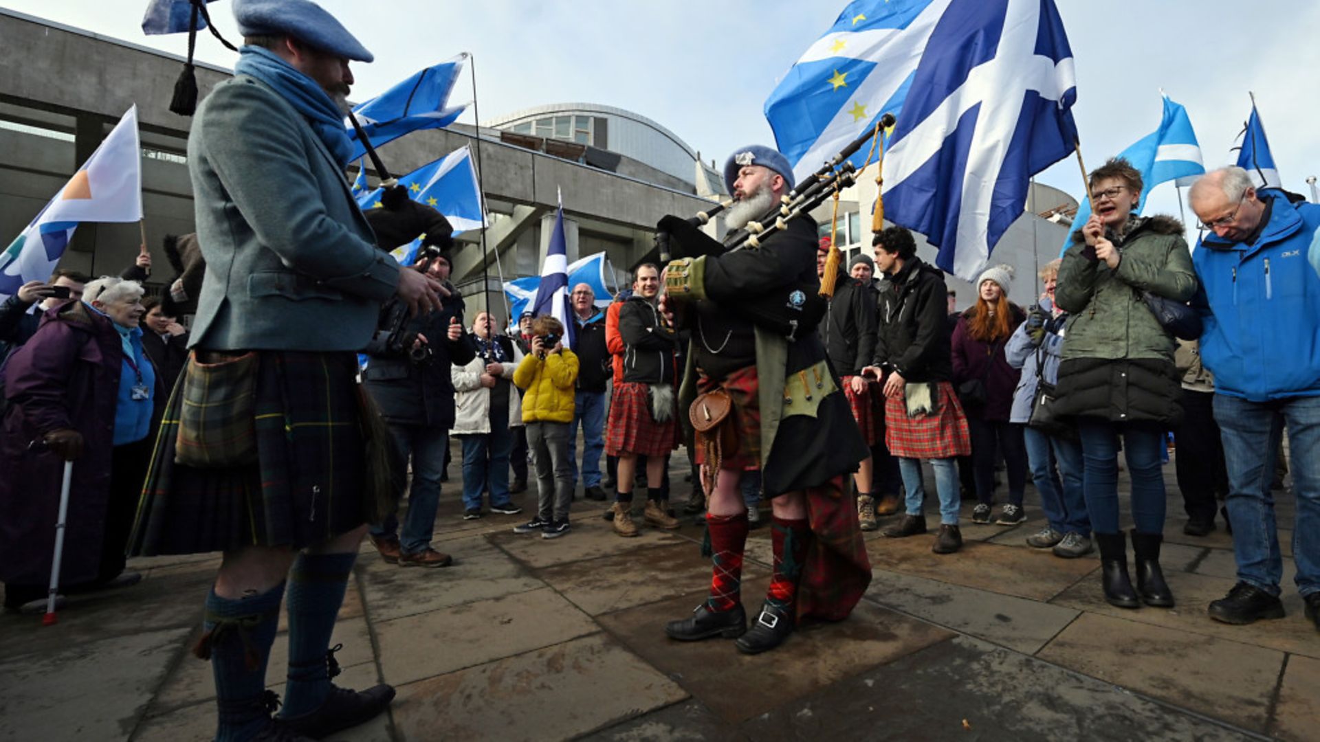 Bagpipe players attend an anti-Conservative government, pro-Scottish independence, and anti-Brexit demonstration outside Holyrood - Credit: Photo by Andy BUCHANAN / AFP