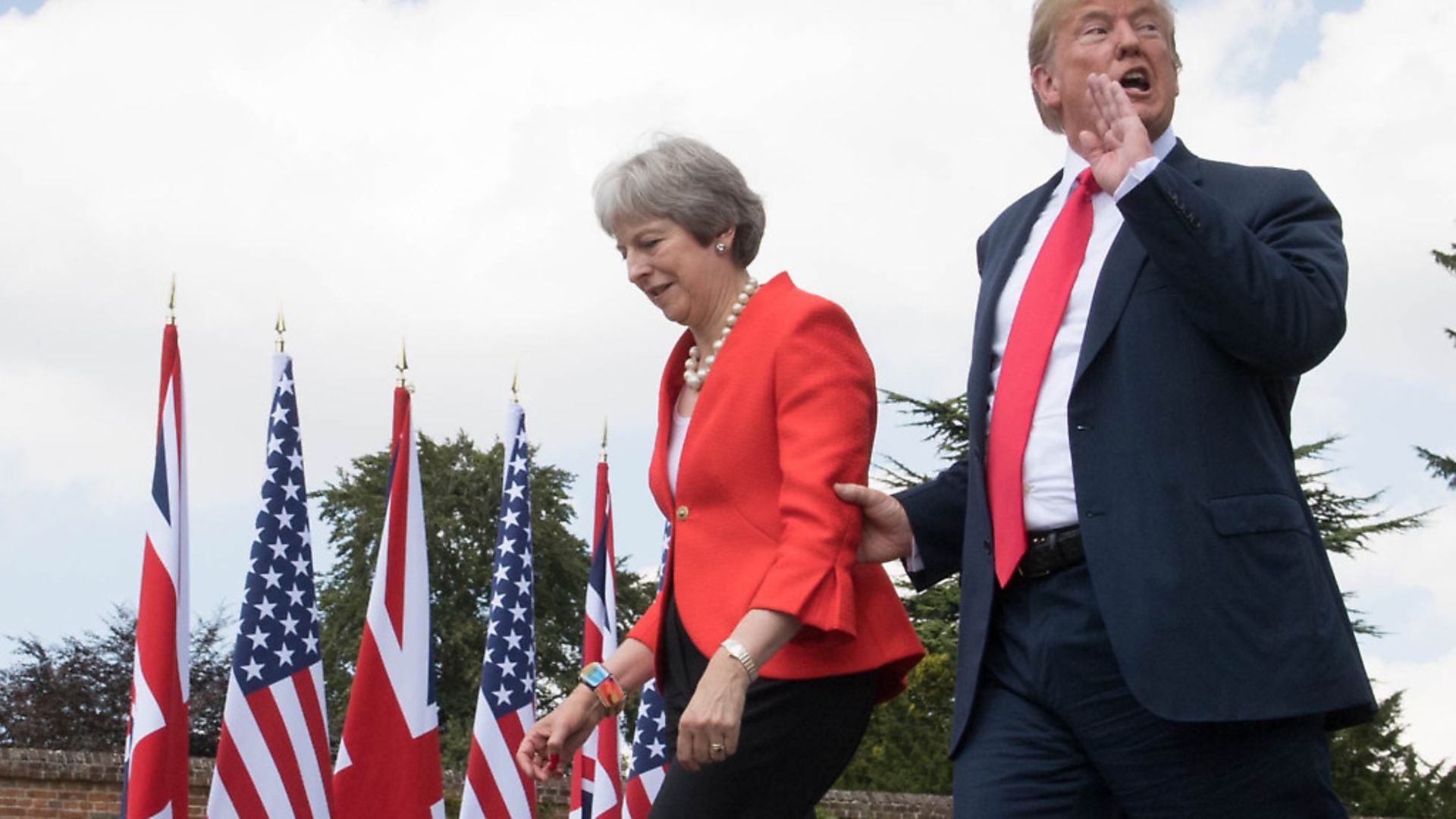 US president Donald Trump walks with prime minister Theresa May prior to a joint press conference at Chequers in Buckinghamshire. Photograph: Stefan Rousseau/PA. - Credit: PA Wire/PA Images