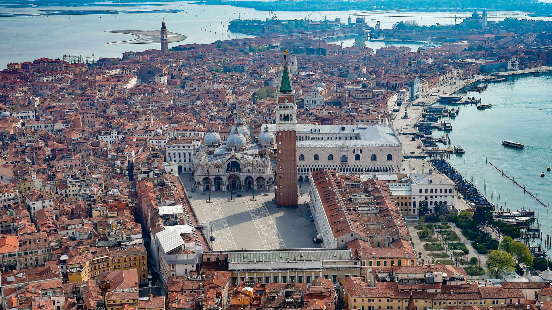 An aerial view from a helicopter of the deserted Piazza San Marco in the center of Venice - Credit: Getty Images