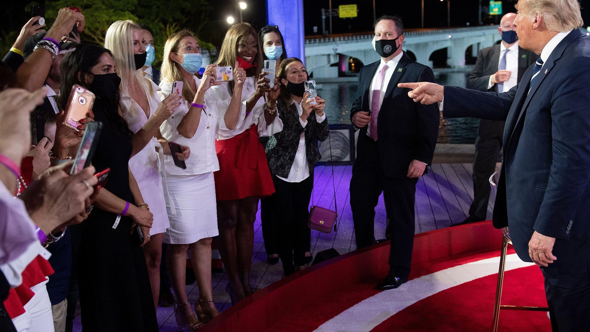 Donald Trump speaks with audience members after participating in an NBC News town hall event at the Perez Art Museum in Miami on October 15, 2020 - Credit: AFP via Getty Images