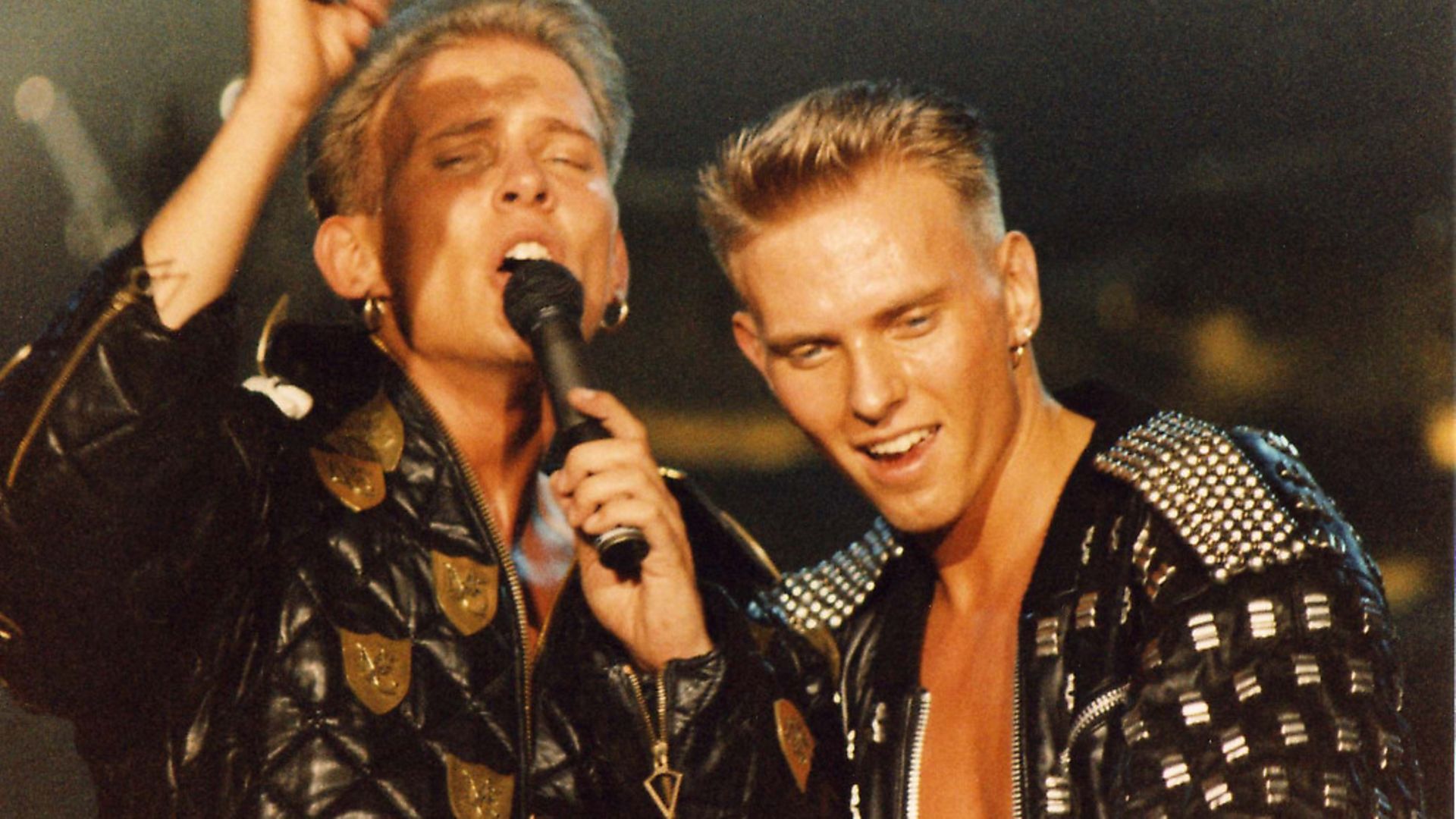 Matt and Luke Goss of Bros perform on stage on 'The Big Push' tour at Wembley Arena on December 28th, 1988 in London, England. (Photo by Peter Still/Redferns) - Credit: Redferns