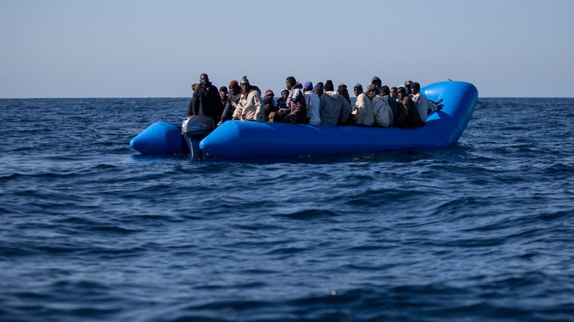 An inflatable boat with 47 migrants on board is pictured while being rescued by the Dutch-flagged Sea Watch 3 off Libya's coasts on January 19, 2019. - Photo: FEDERICO SCOPPA/AFP/Getty Images) - Credit: AFP/Getty Images