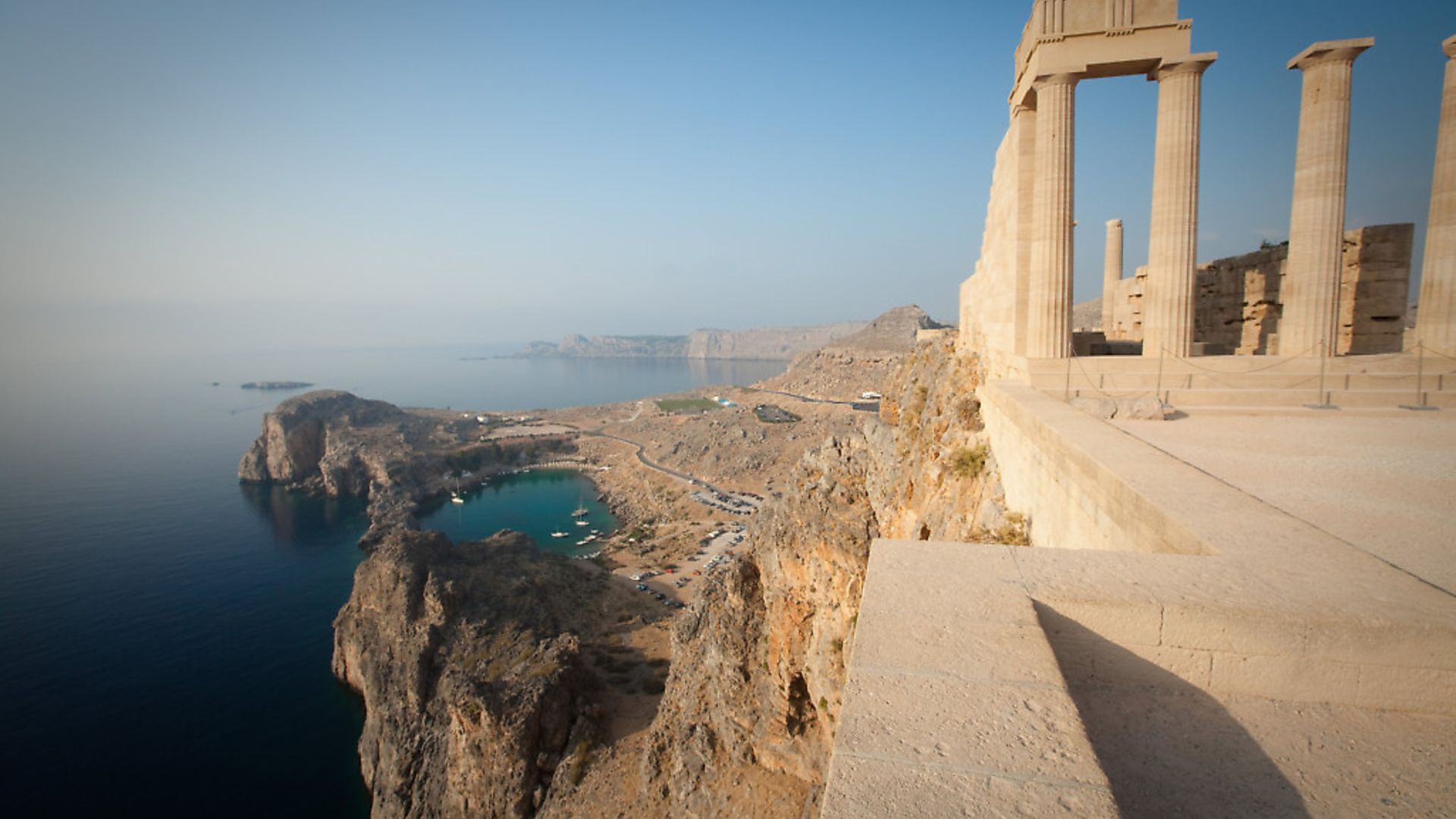 he English word apostrophe comes from a Greek term meaning turning away. Acropolis of Lindos, overlooking St. Paul's Bay, Lindos, Rhodes, Greece. - Credit: Getty Images