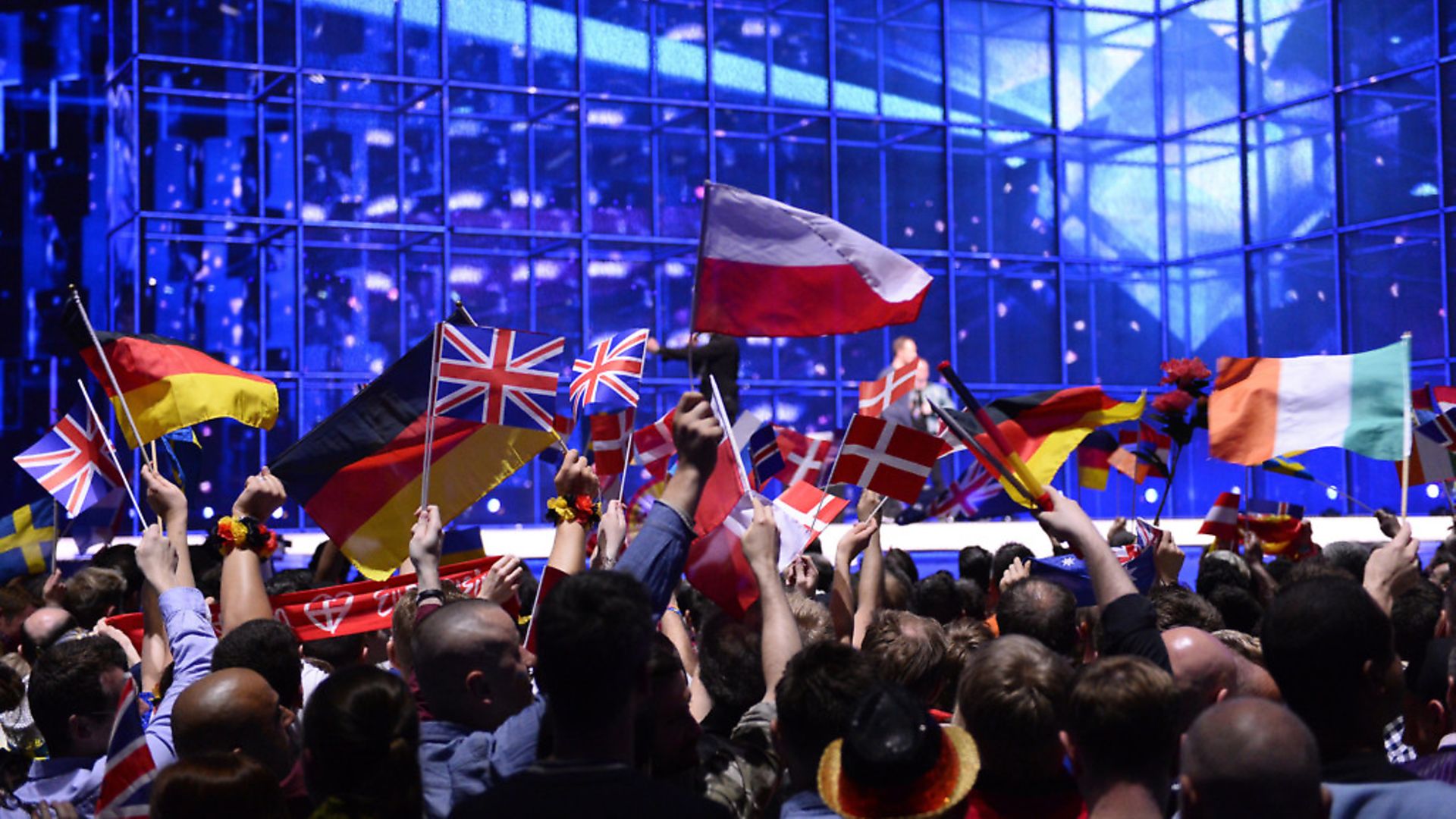 Supporters wave flags ahead of the Eurovision Song Contest (question five) (JONATHAN NACKSTRAND/AFP/Getty Images) - Credit: AFP/Getty Images