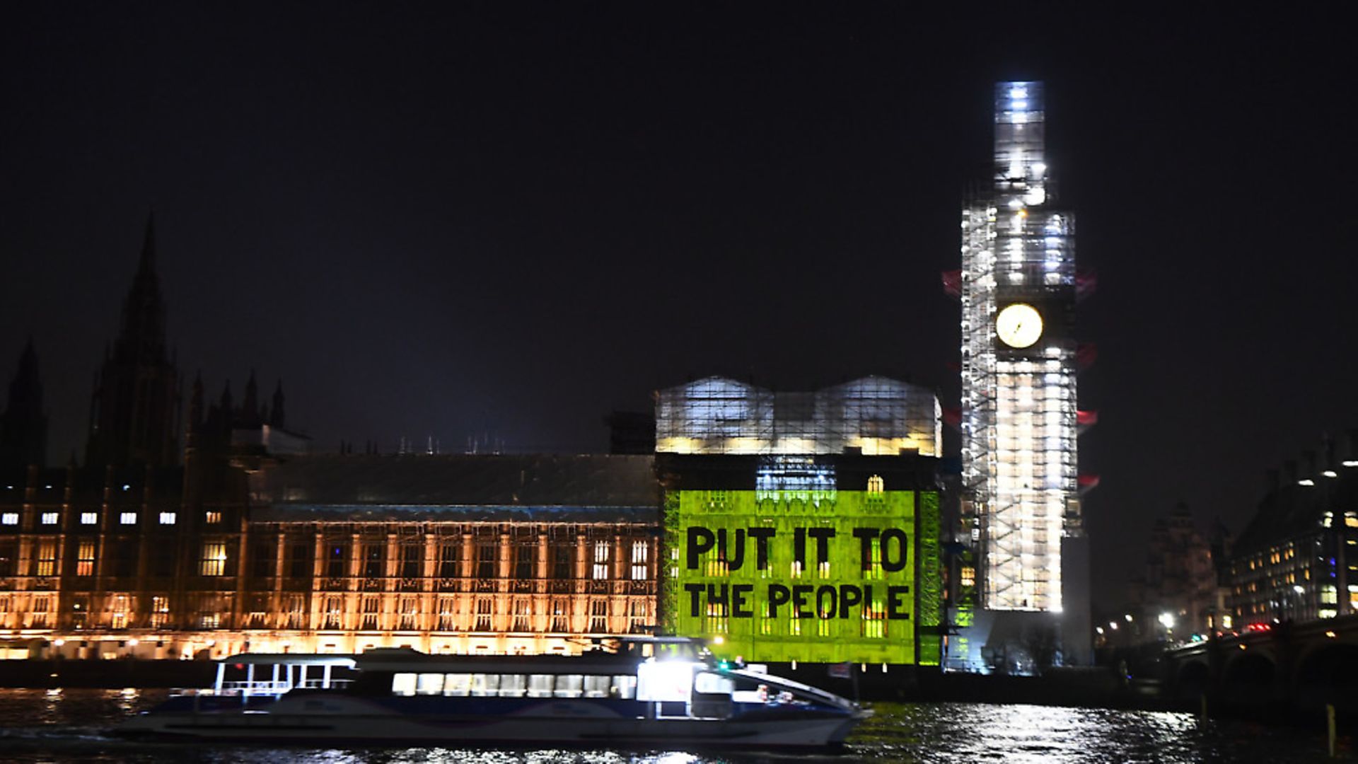 A message projected on to the House of Commons urges MPs to "put it to the people". Photograph: Victoria Jones/PA Wire. - Credit: PA
