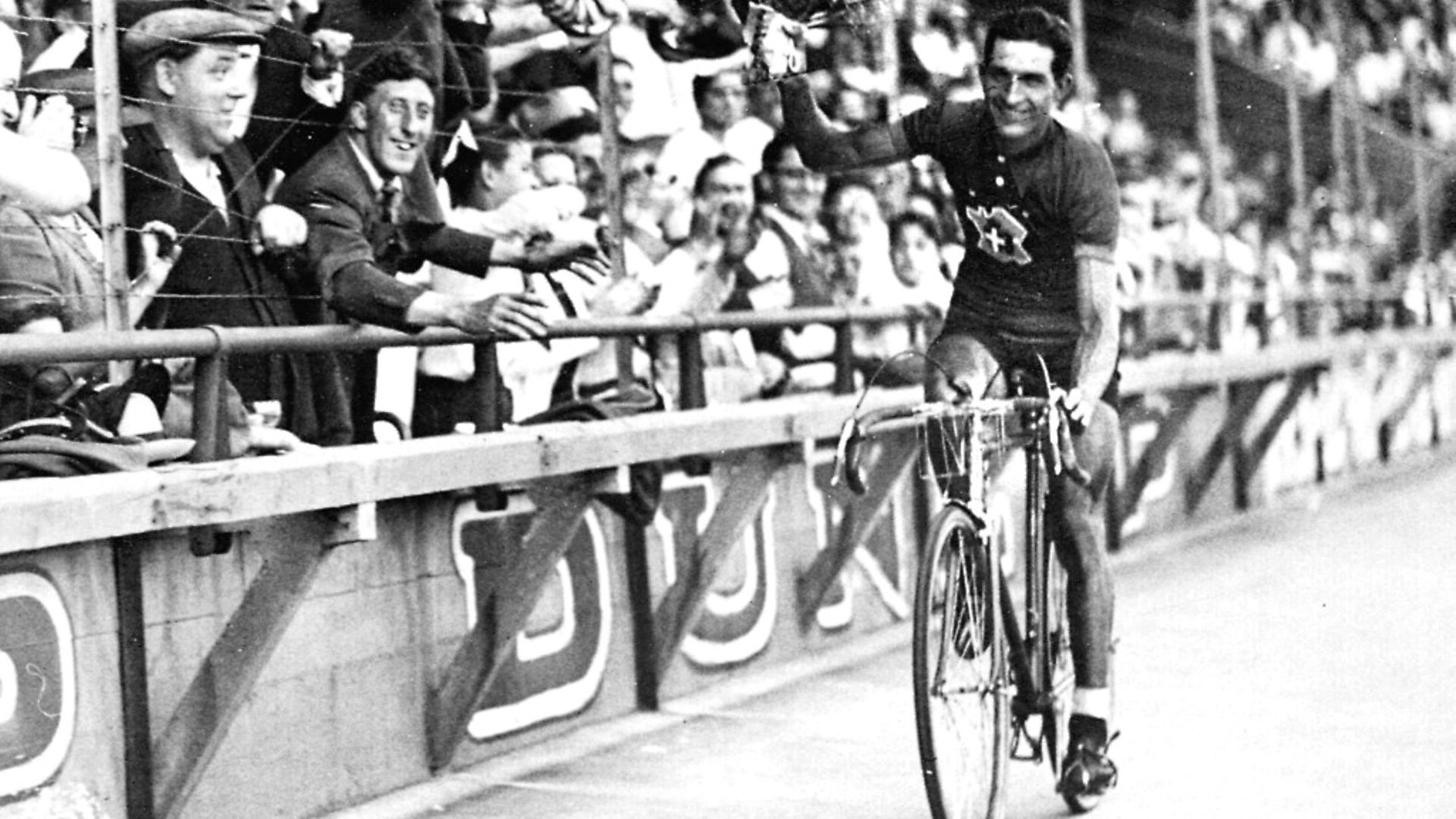Italian racing cyclist Gino Bartali celebrating his Tour de France victory, 31st July 1938. Photo by Roger Viollet/Getty Images - Credit: Roger Viollet/Getty Images