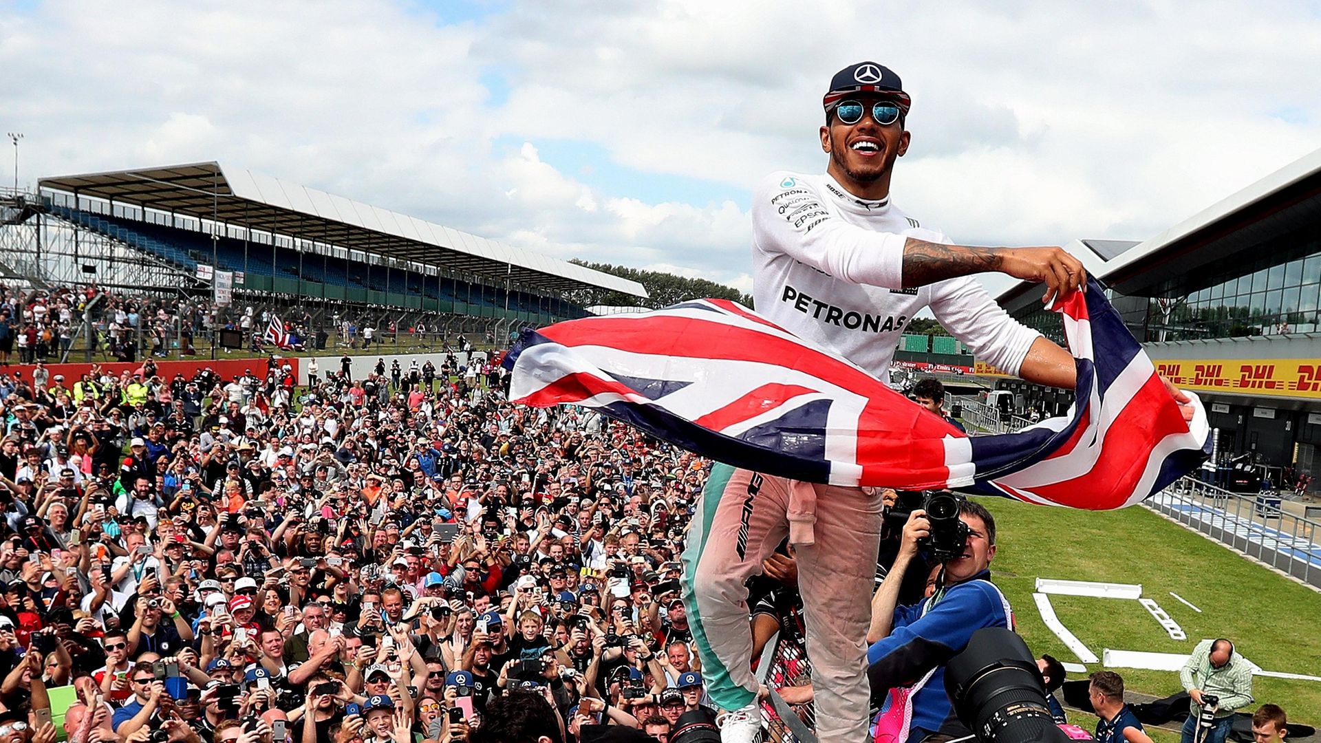 Lewis Hamilton celebrates his victory with the crowd after winning the 2016 British Grand Prix at Silverstone (question two) - Credit: PA