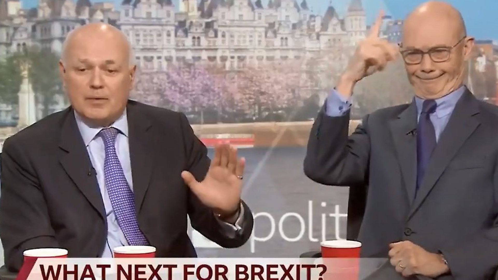 Pascal Lamy appears to mimick a unicorn behind Iain Duncan Smith's back. Photograph: BBC. - Credit: Archant