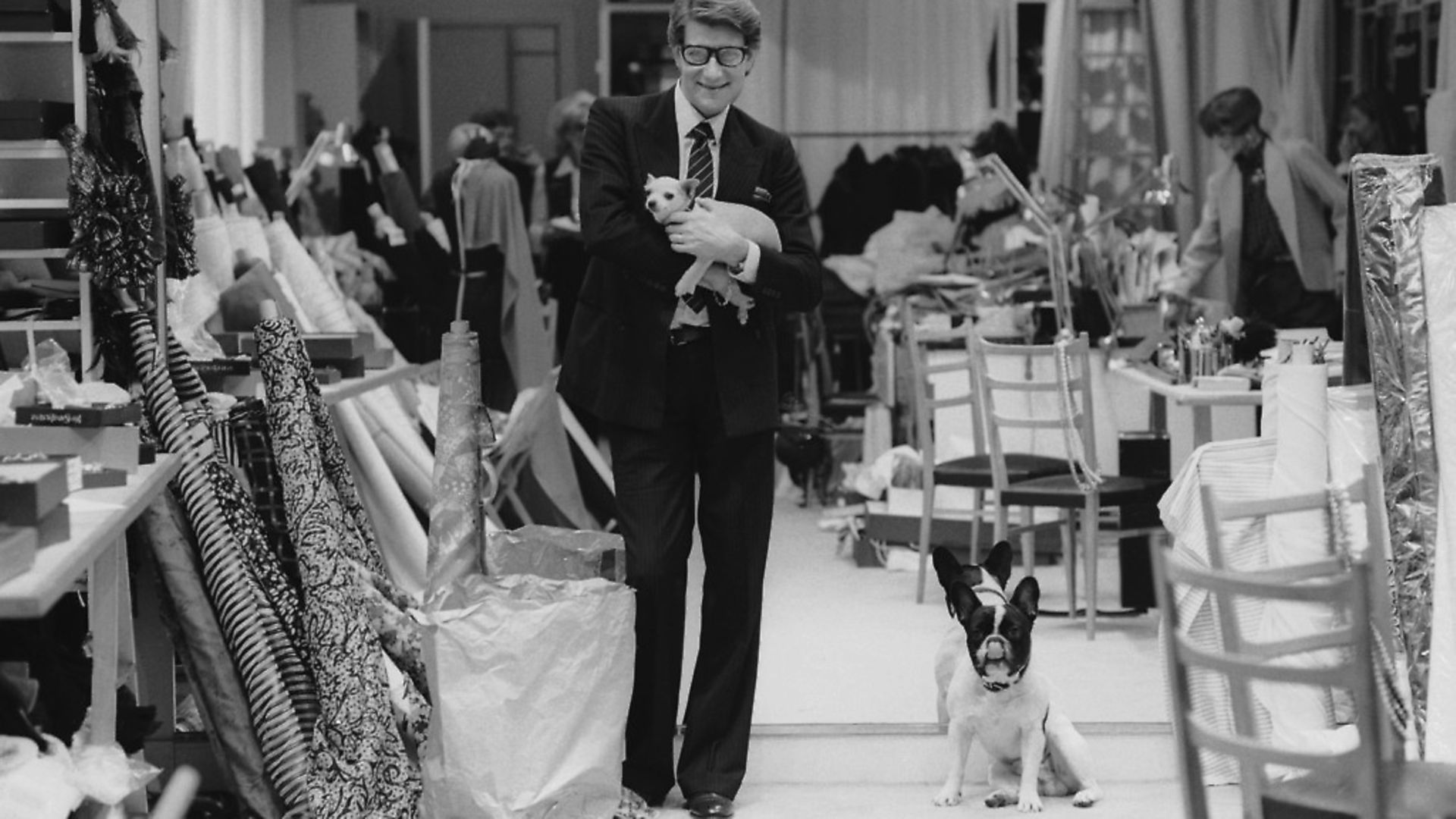 French fashion designer Yves Saint Laurent (1936 - 2008) in his Paris studio, January 1982. (Photo by John Downing/Getty Images) - Credit: Getty Images