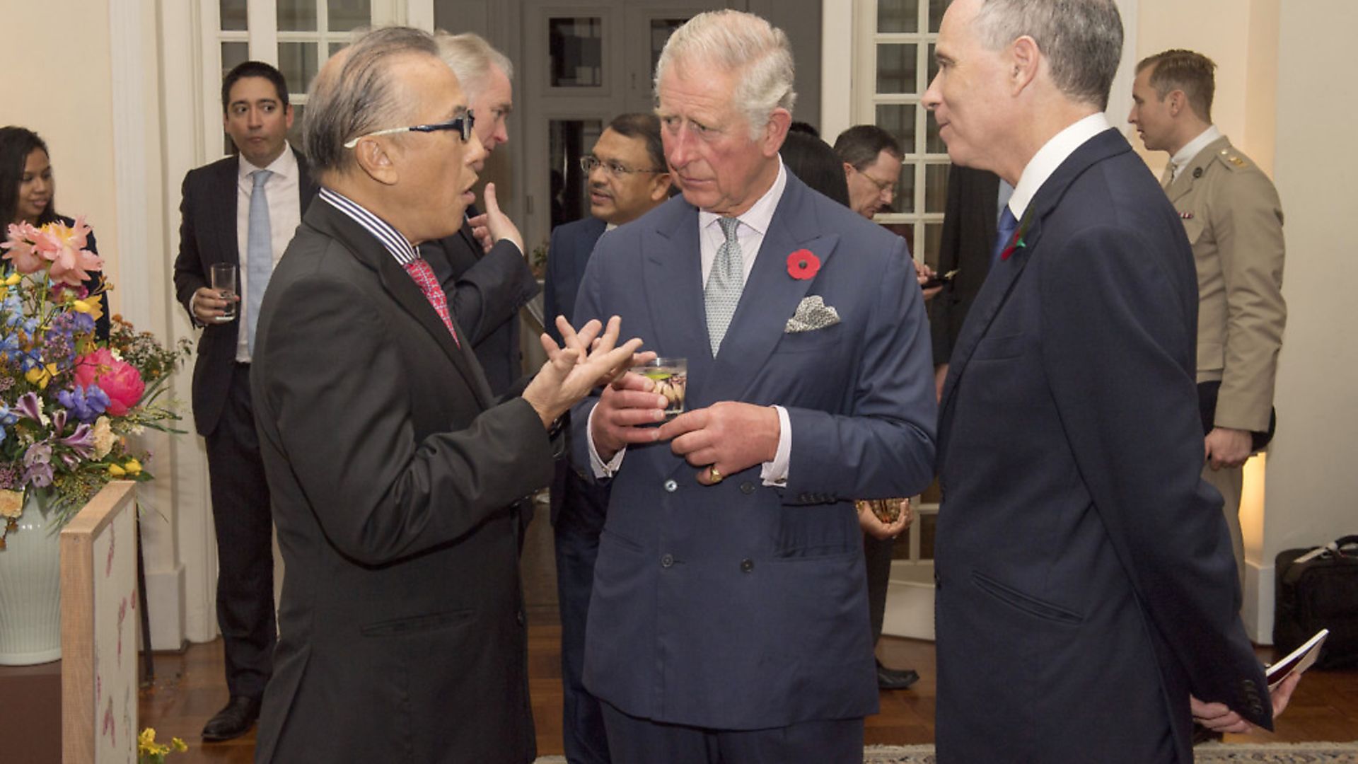 The Prince of Wales (centre) chats with an unnamed guest and British High Commissioner Scott Wightman (right) at a reception at the British High Commissioner's Residence in Singapore. (Arthur Edwards/The Sun/PA) - Credit: PA Archive/PA Images