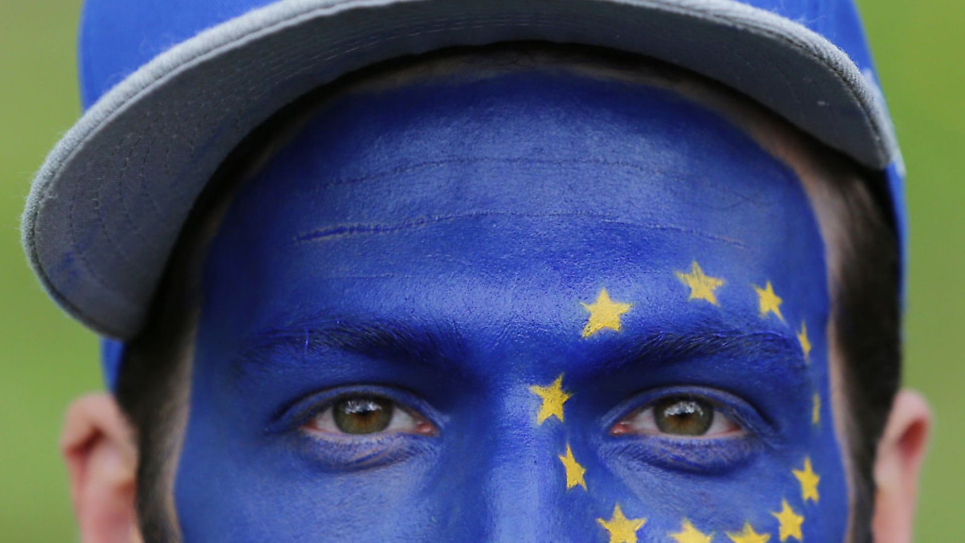 A man with the flag of the European Union painted on his face as Remain supporters gather for a protest. Daniel Leal-Olivas/PA. - Credit: PA Archive/PA Images