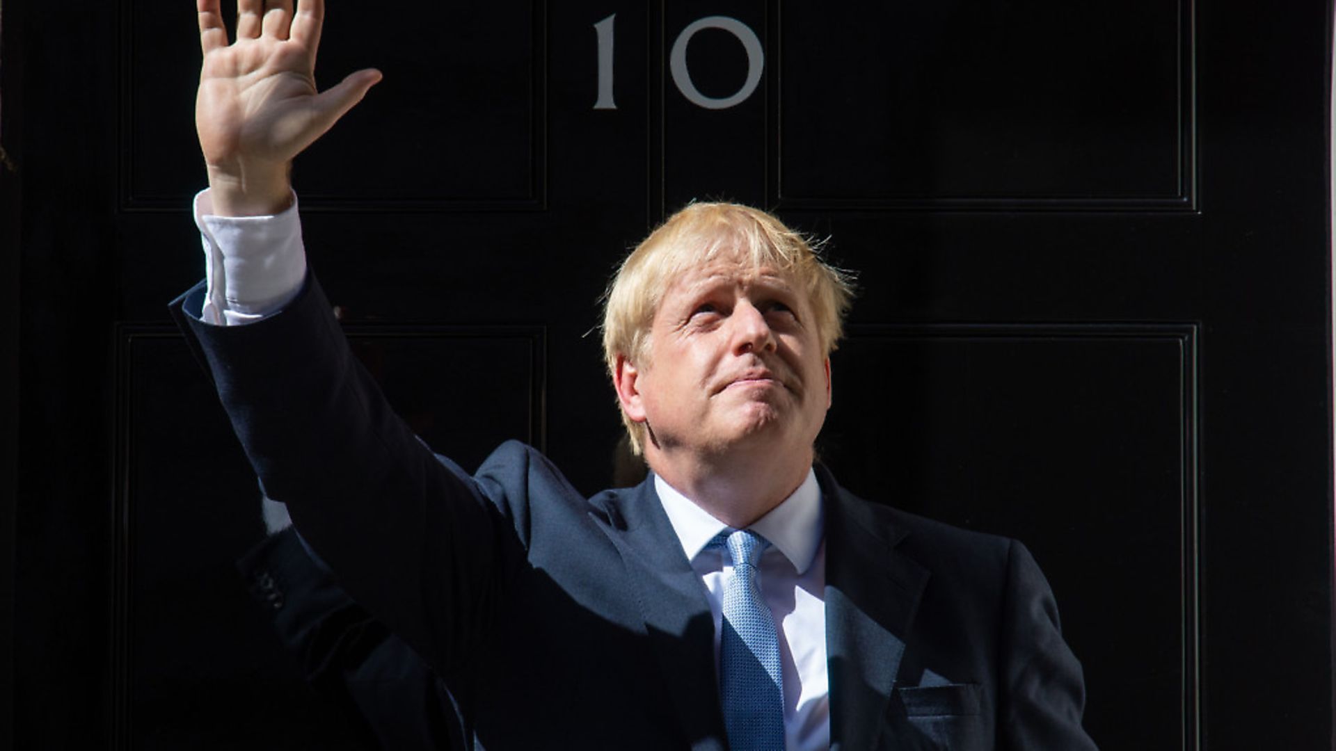 Boris Johnson waves on the steps of 10 Downing Street. Photograph: Dominic Lipinski/PA Wire. - Credit: PA