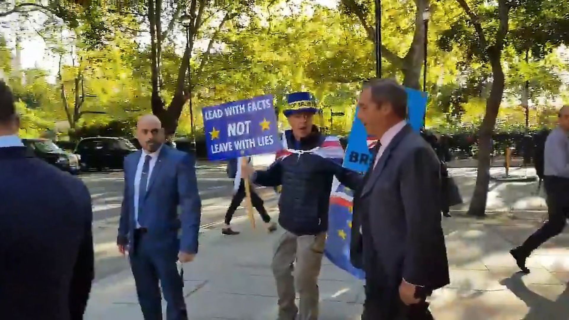 Steve Bray bumps into Nigel Farage. Photograph: Steve Bray/Twitter. - Credit: Archant