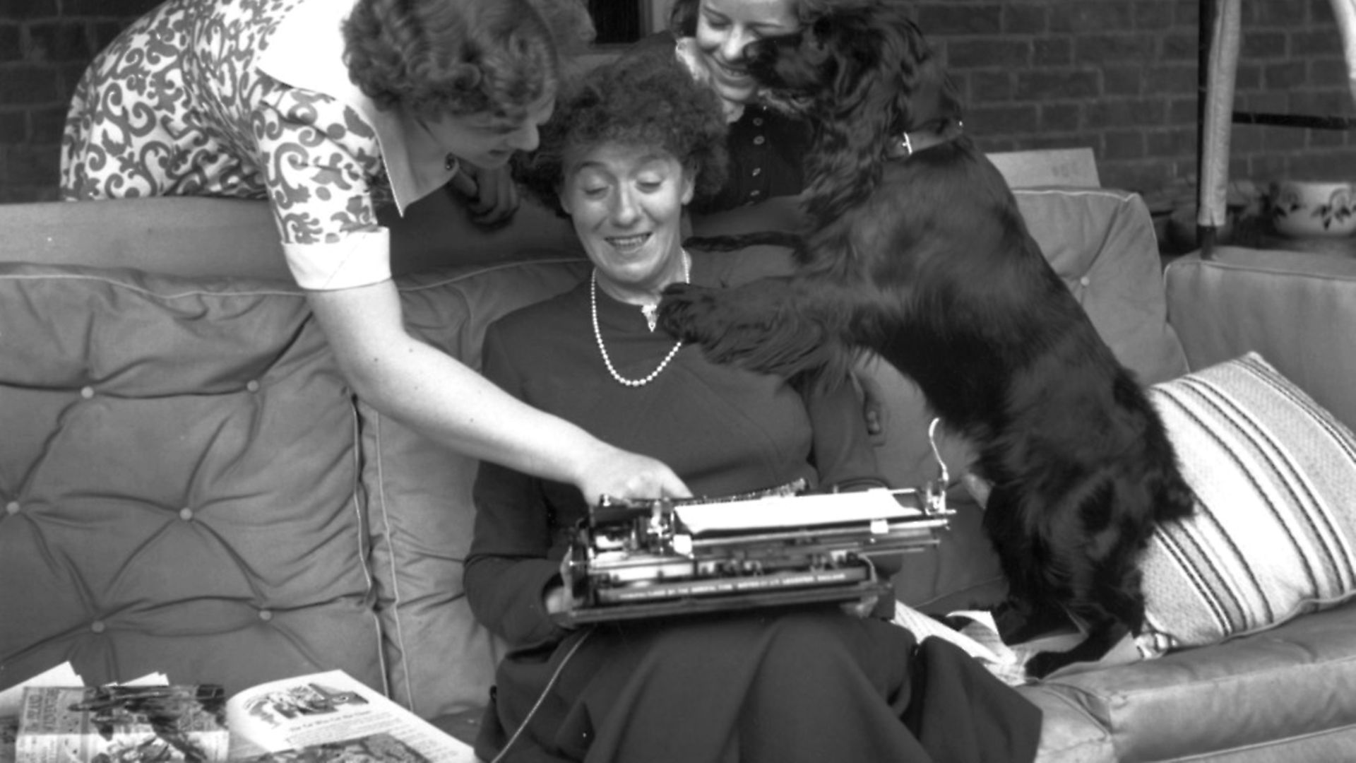 May 1949:  English author and writer of books for children Enid Mary Blyton (1897-1968) at her home in Beaconsfield, Buckinghamshire, with her daughters Gillian (left) and Imogen.  (Photo by George Konig/Keystone Features/Getty Images) - Credit: Getty Images