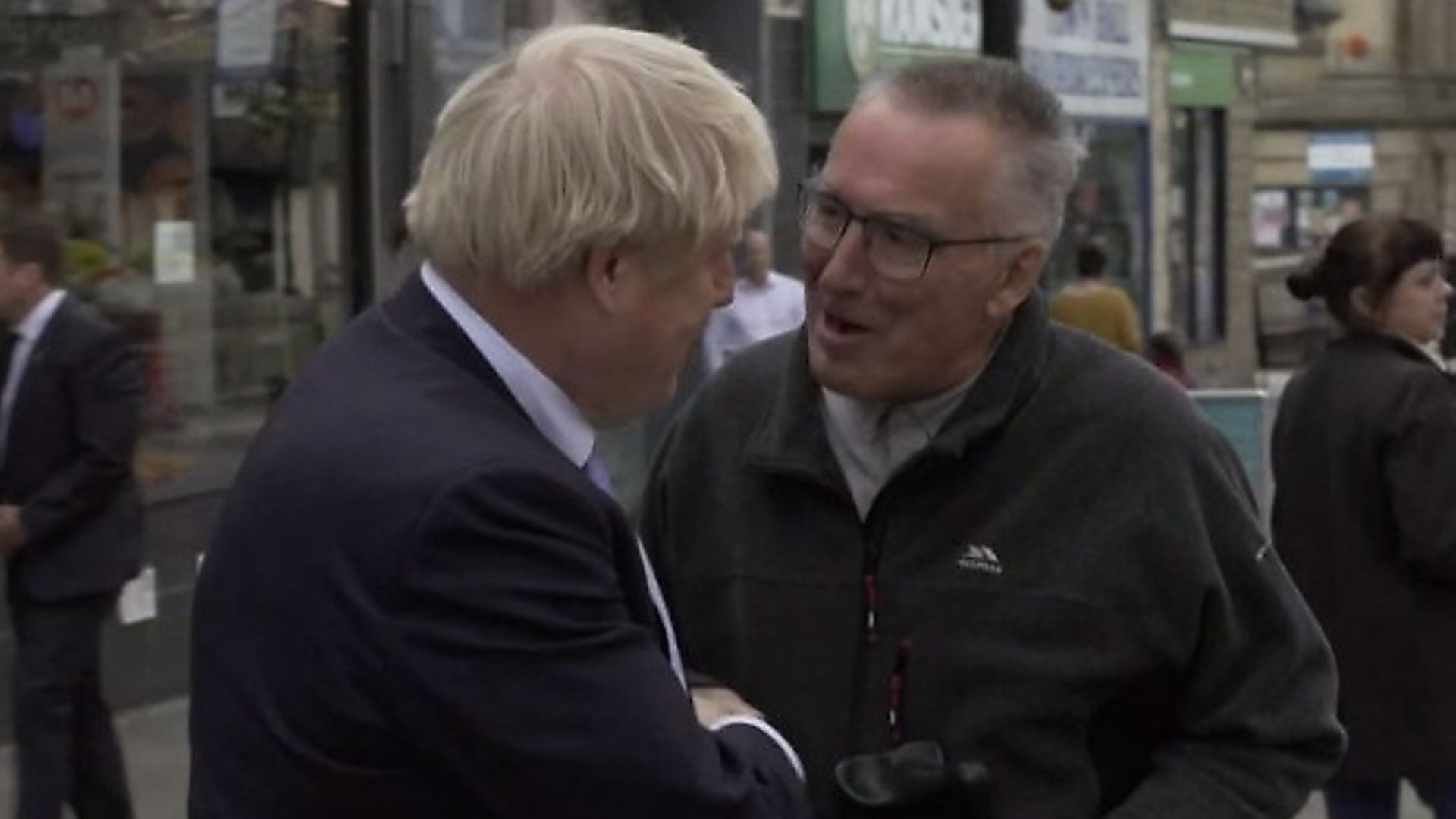A passer-by tells Boris Johnson: "Please leave my town". Photograph: BBC. - Credit: Archant