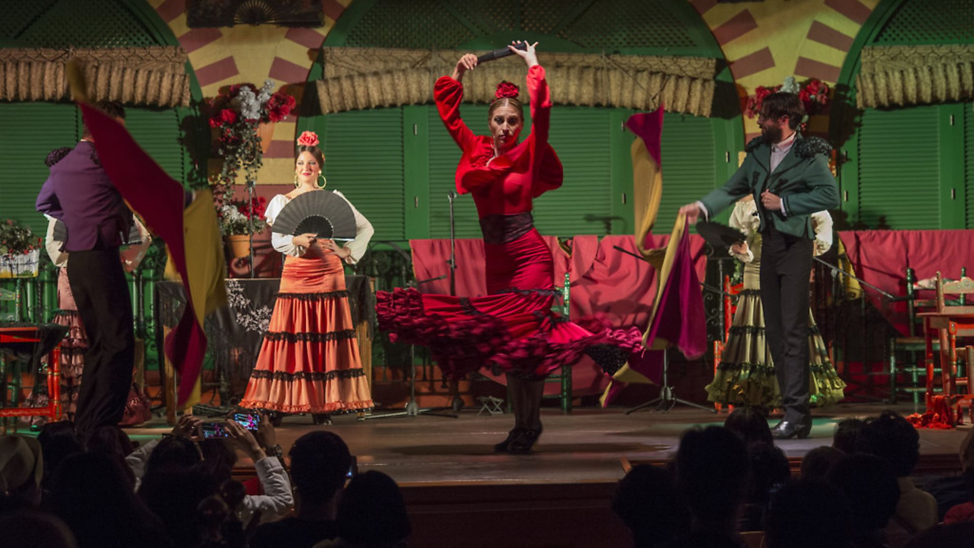 Dancers and musicians performing the Flamenco, a form of Spanish folk music and dance, during a dinner show in Seville, Andalusia, Spain. (Photo by Wolfgang Kaehler/LightRocket via Getty Images) - Credit: LightRocket via Getty Images