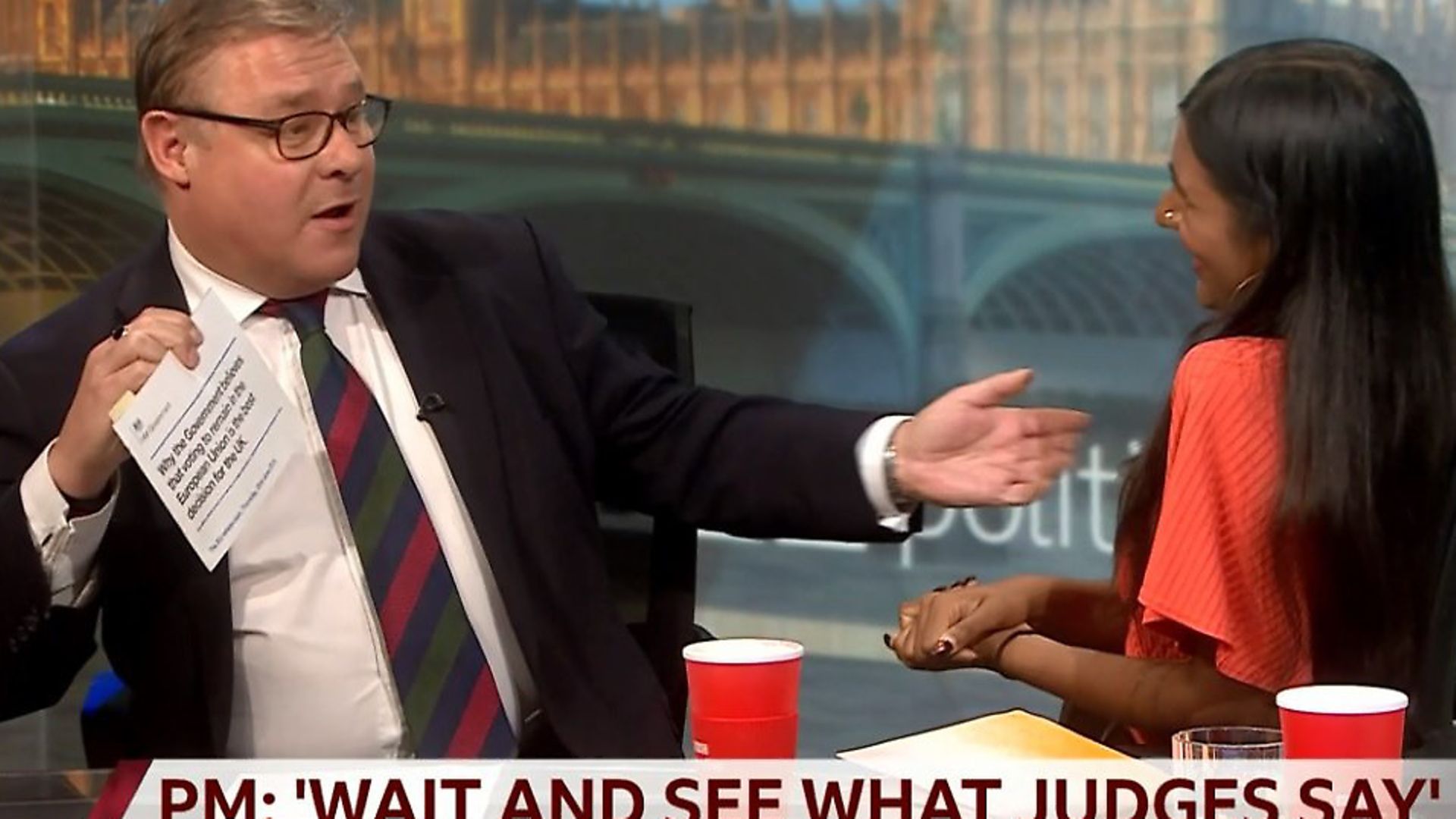 Mark Francois presents the government's EU referendum leaflet to Ash Sarkar on the BBC's Politics Live. Photograph: BBC. - Credit: Archant