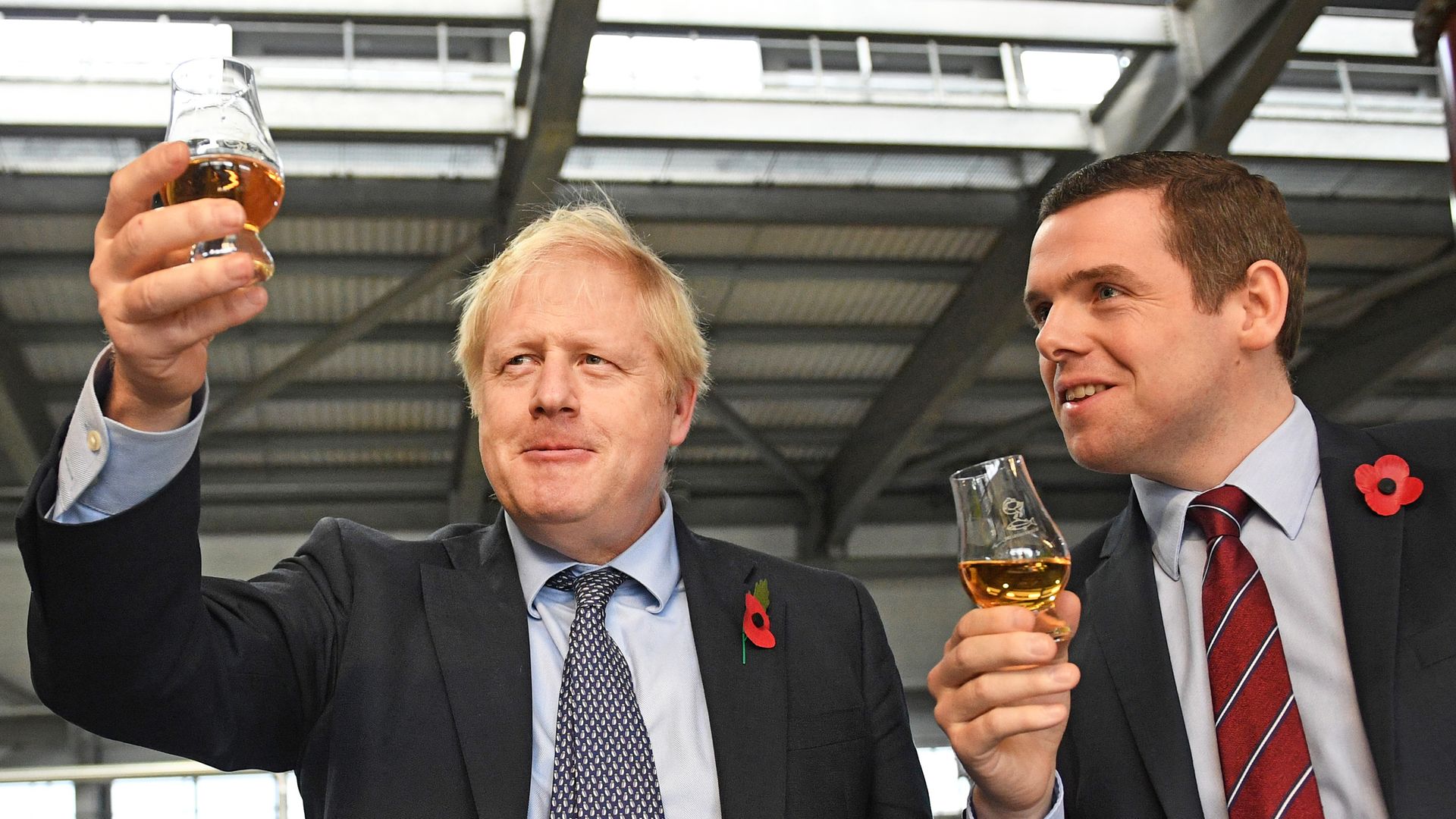 Prime Minister Boris Johnson (left) alongside MP Douglas Ross - Credit: PA