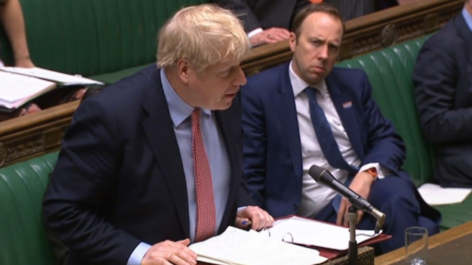 Health Secretary Matt Hancock watches Prime Minister Boris Johnson speak during Prime Minister's Questions in the House of Commons. Photograph: House of Commons/PA Wire. - Credit: PA