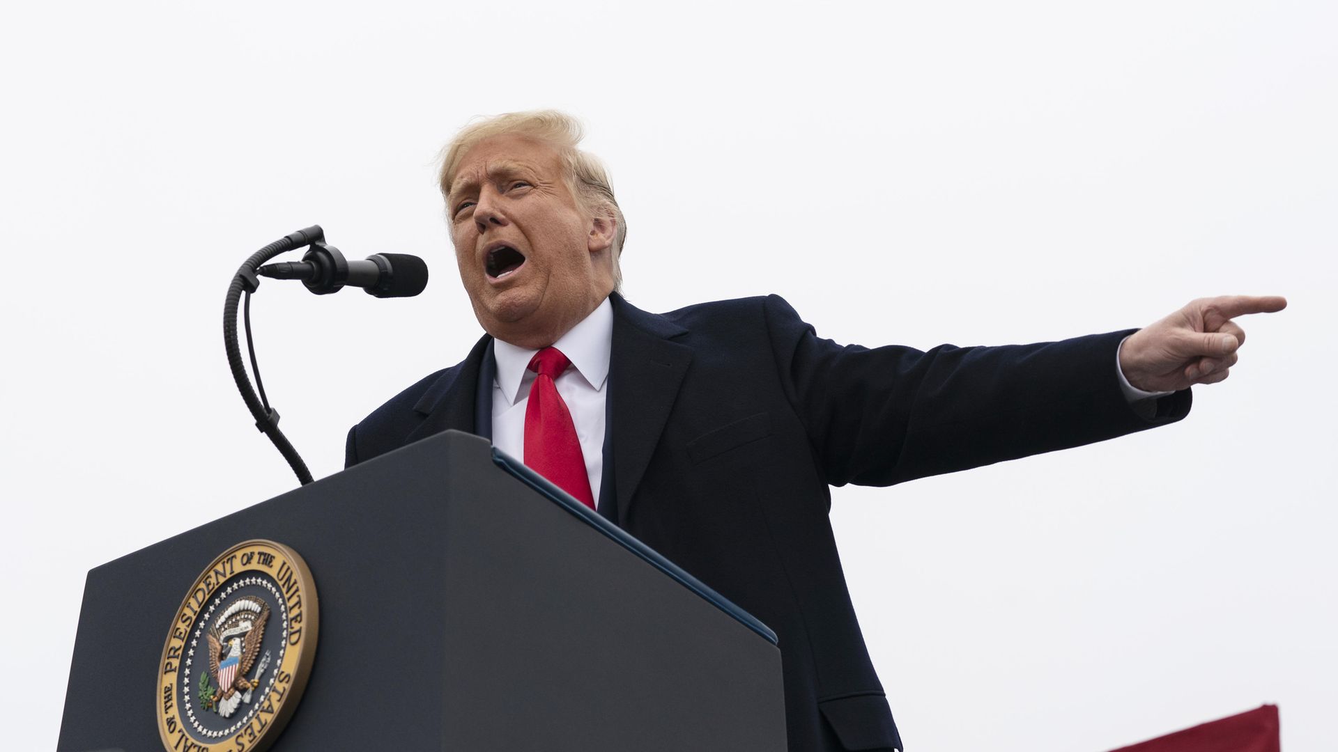 President Donald Trump speaks at a campaign rally - Credit: PA