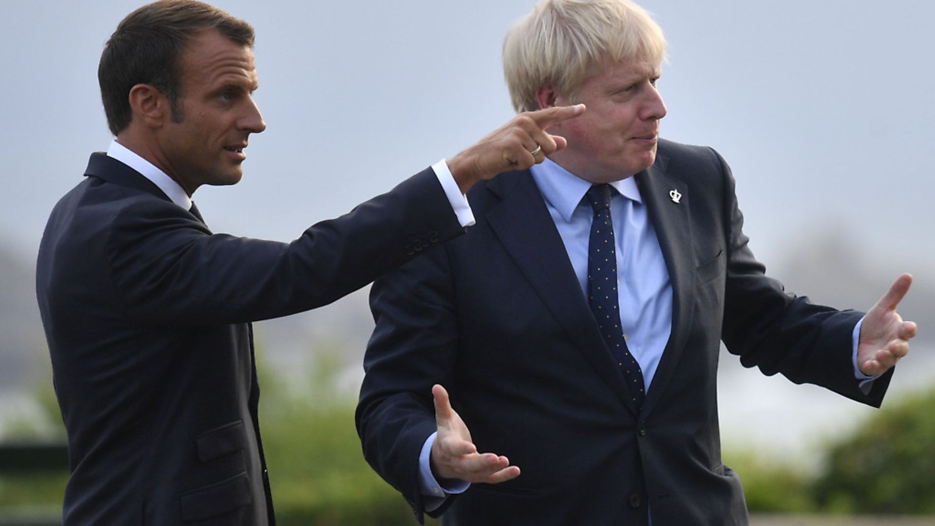 French President Emmanuel Macron speaks with prime Minister Boris Johnson. Photograph: Neil Hall/PA. - Credit: PA Wire/PA Images