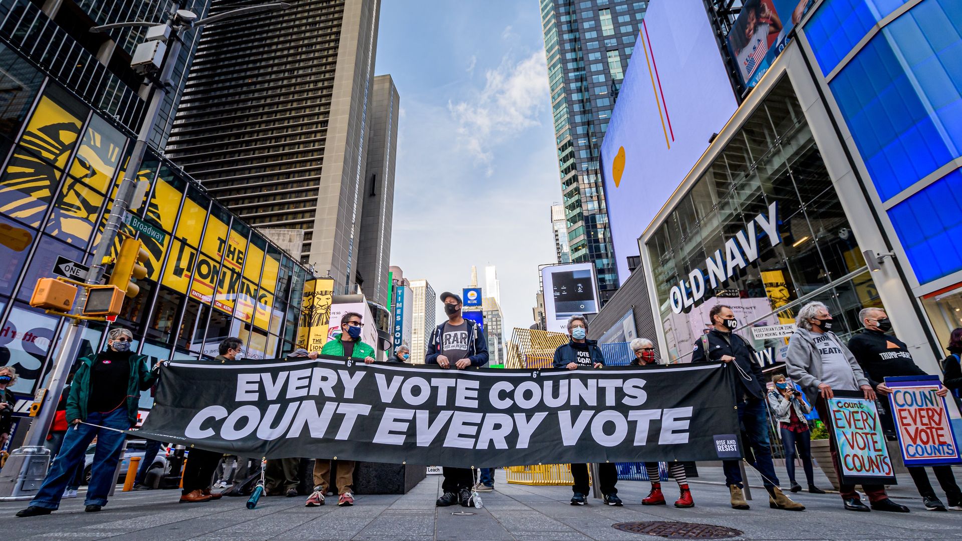 Participants holding a banner reading: "EVERY VOTE COUNTS/COUNT EVERY VOTE" at the protest in Times Square. - Credit: LightRocket via Getty Images