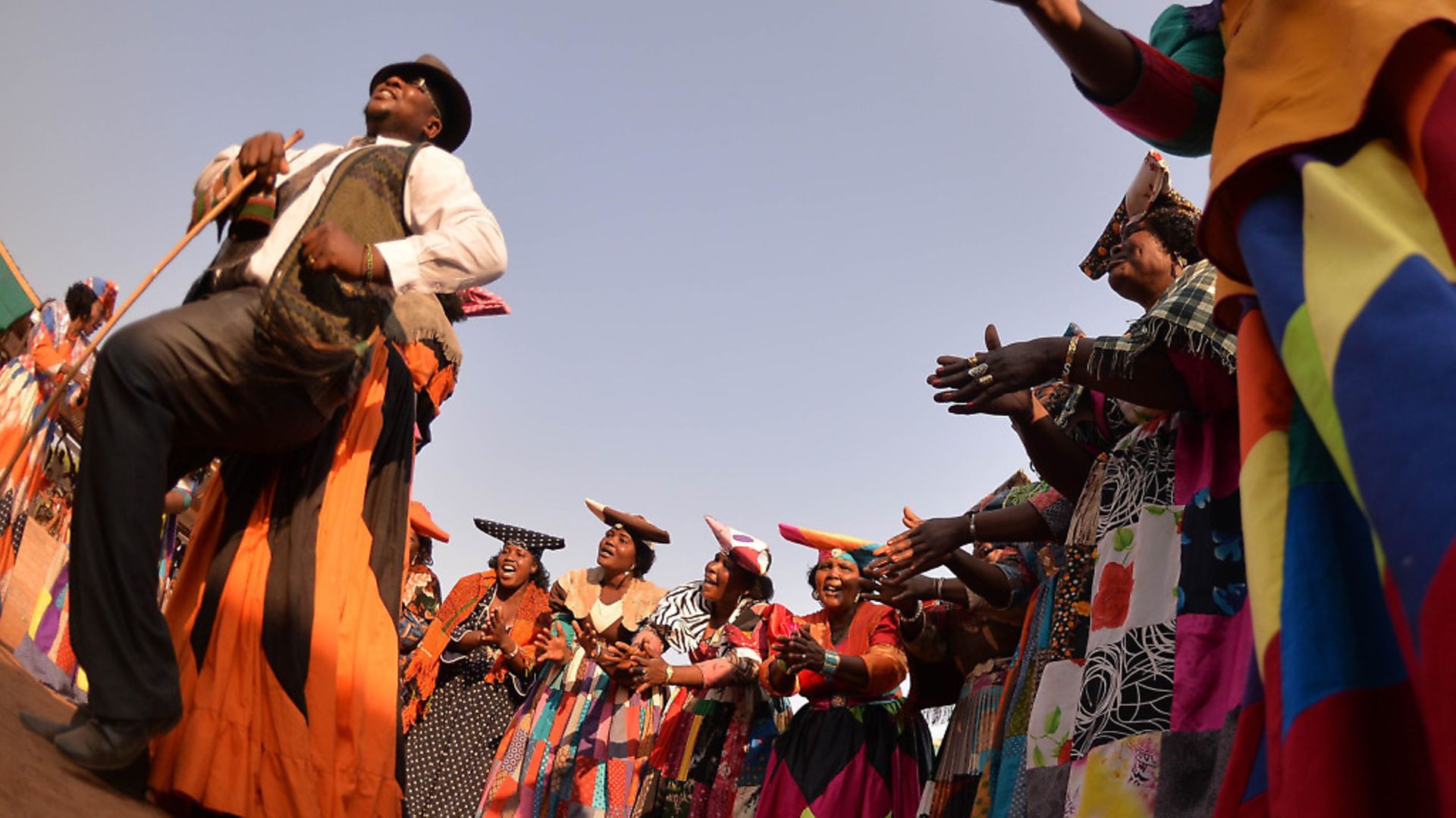 Member of the cultural group Herero perform during the 17th Kuru Festival in Ghanzi, on August 29, 2015. The Kuru festival mainly features the San dance and culture in Botswana. AFP PHOTO/MONIRUL BHUIYAN        (Photo credit should read Monirul Bhuiyan/AFP/Getty Images) - Credit: AFP/Getty Images