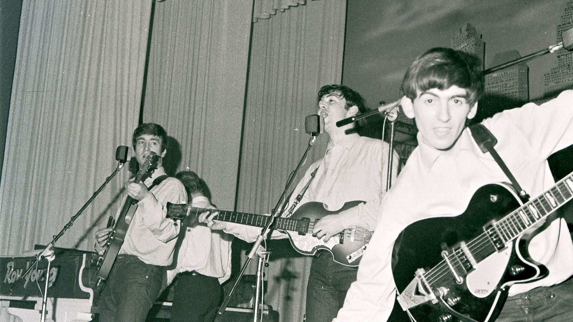 John Lennon, Paul McCartney and George Harrison of the Beatles, at Hamburg's Star-Club, circa May 1962 at the Star-Club in Hamburg, Germany - Credit: Redferns