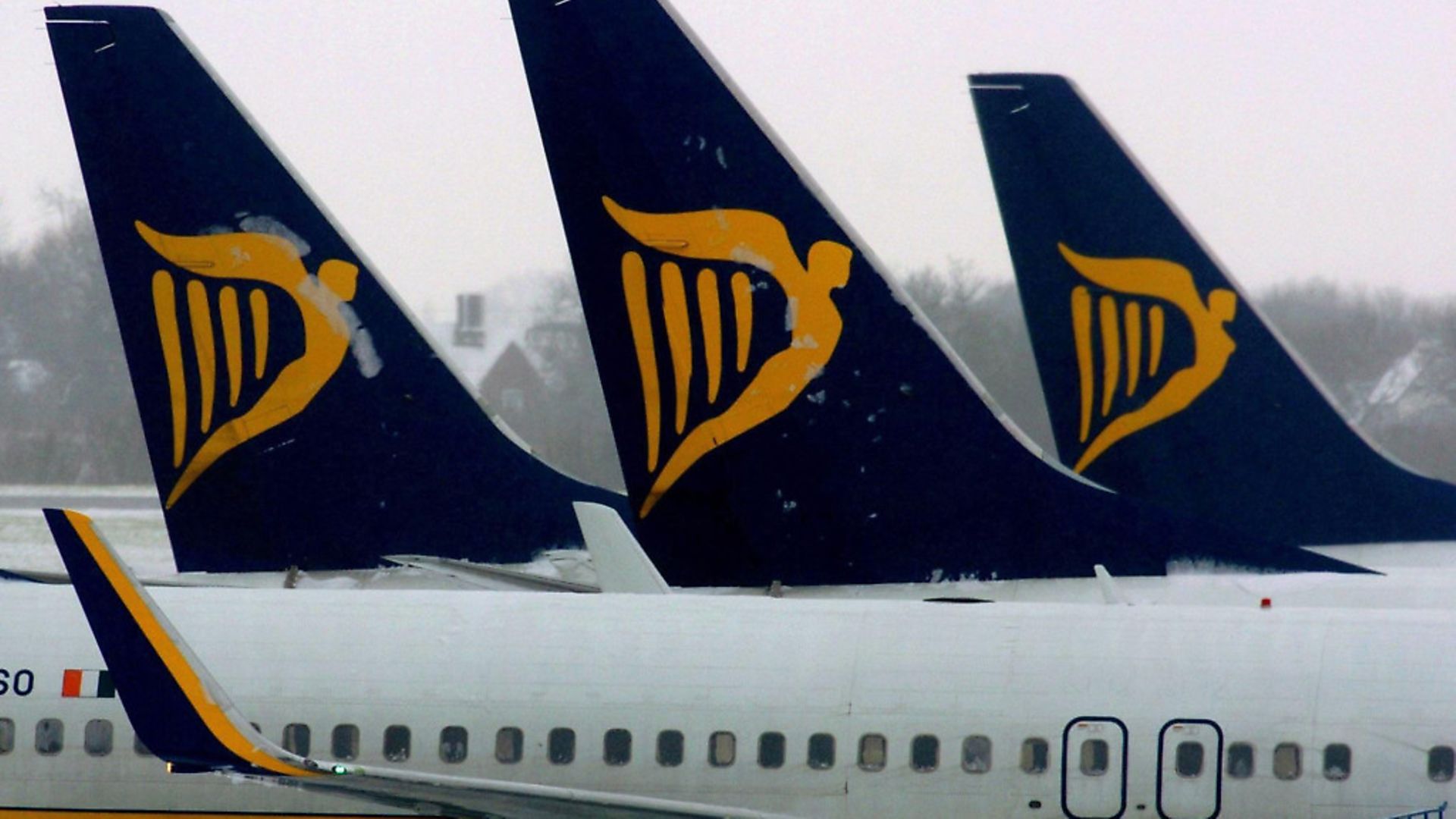 Ryanair planes wait on the snow-covered tarmac at Stansted Airport in Essex (question eight) Pic: PA Archive/ PA Images - Credit: PA Archive/PA Images