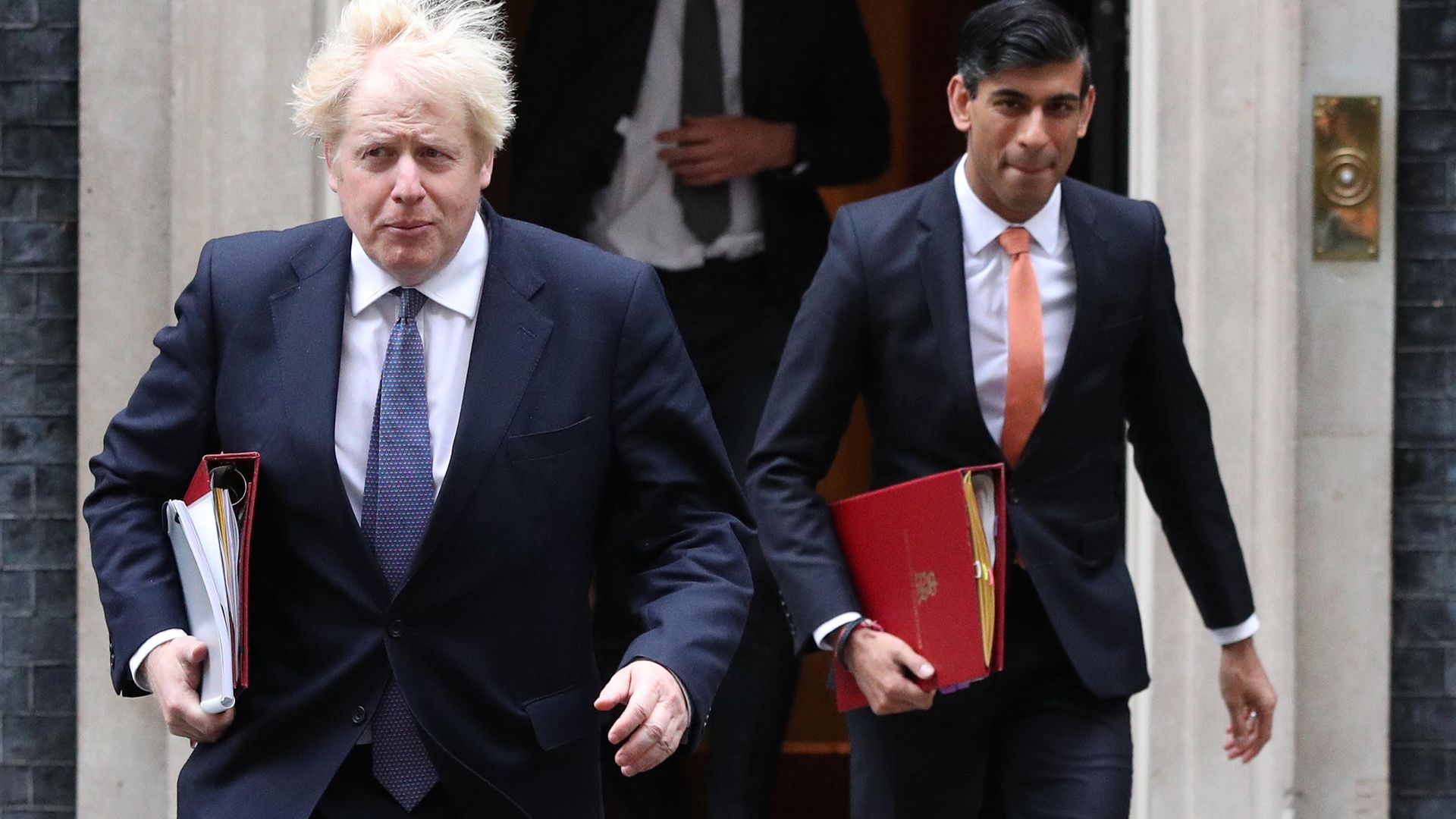 Prime minister Boris Johnson (left) and chancellor Rishi Sunak leave 10 Downing Street London, ahead of a Cabinet meeting at the Foreign and Commonwealth Office. - Credit: PA