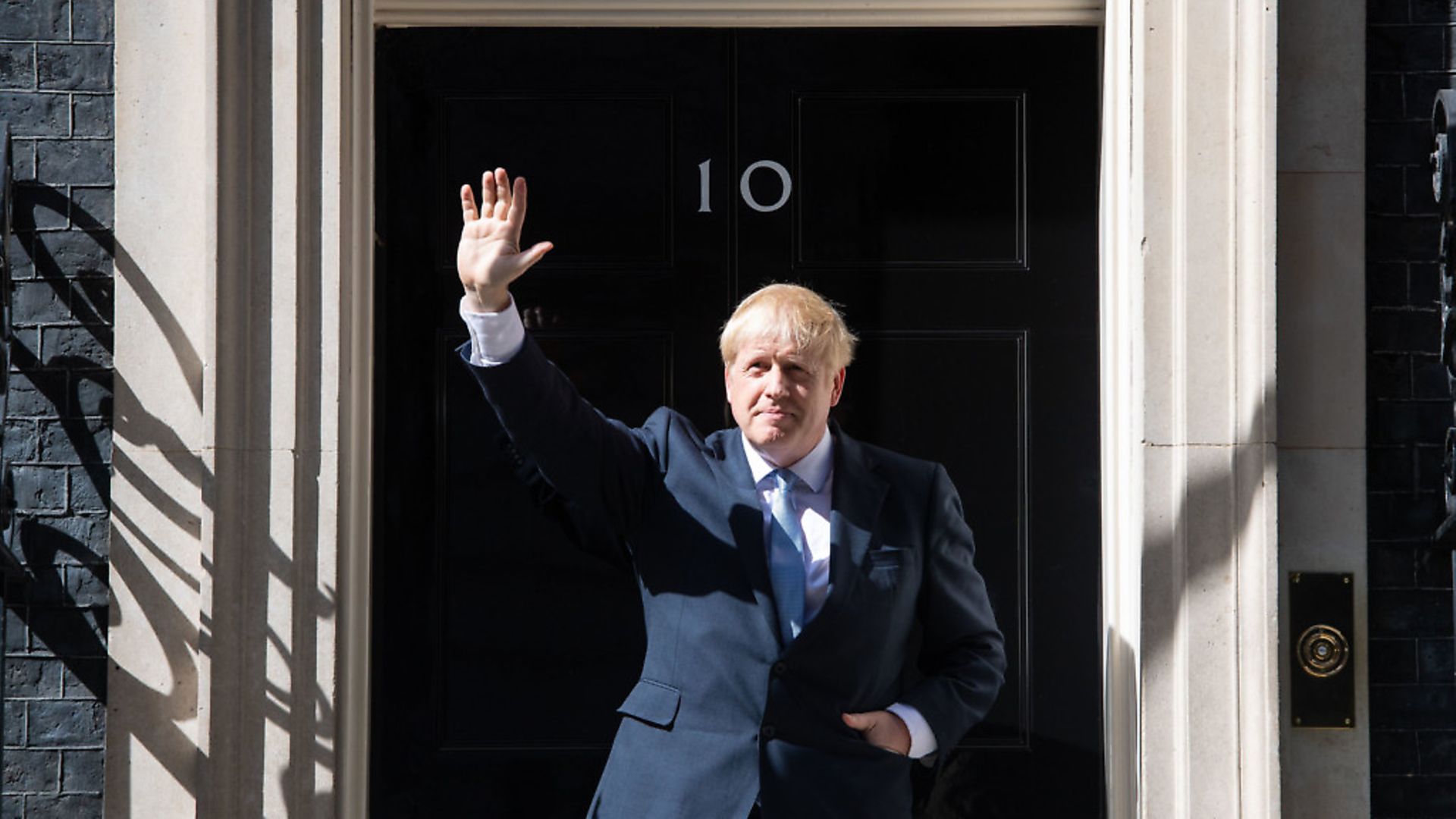 New Prime Minister Boris Johnson waves on the steps of 10 Downing Street, London, after meeting Queen Elizabeth II and accepting her invitation to become Prime Minister and form a new government. - Credit: PA Wire/PA Images