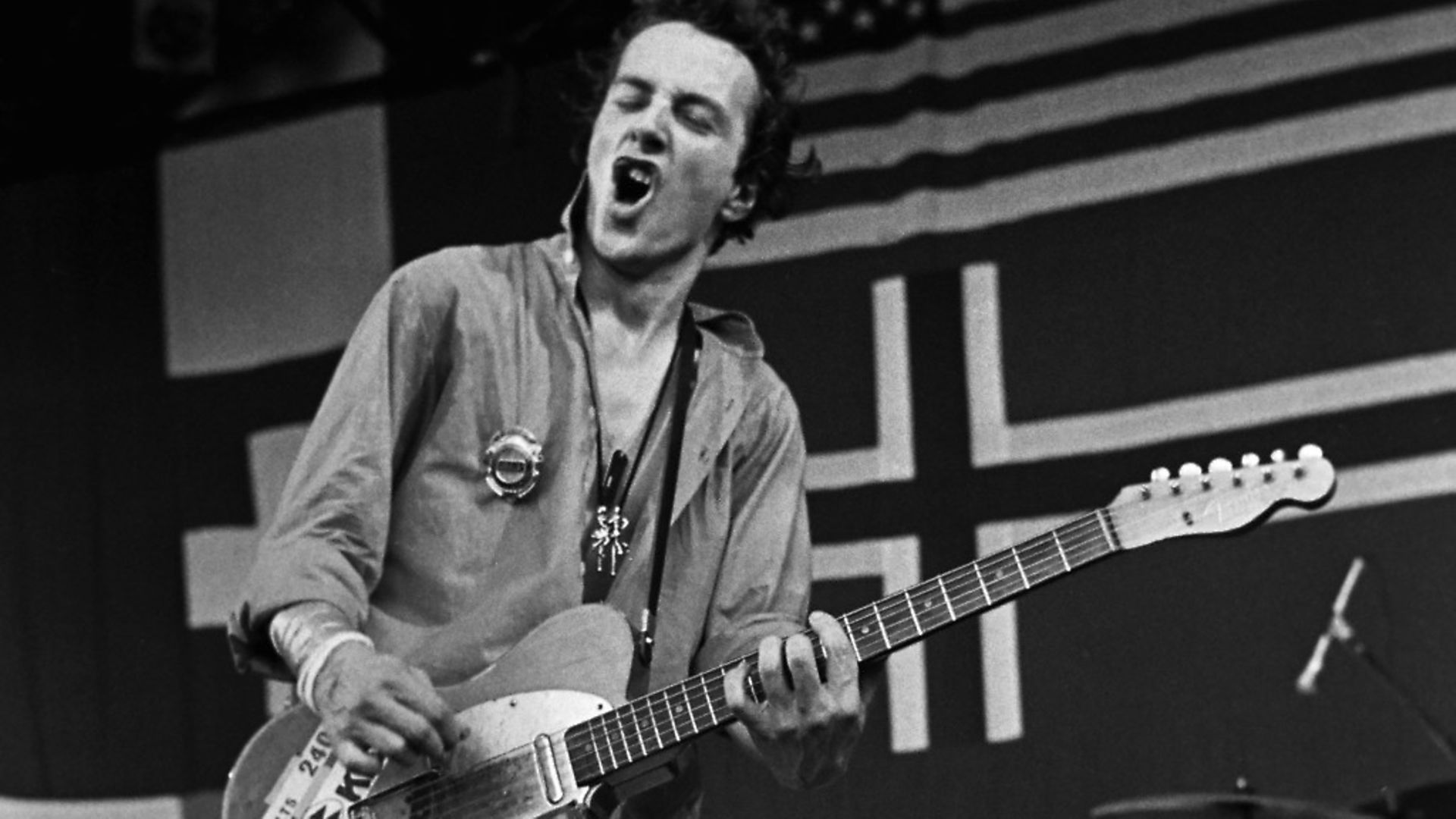 MONTEREY, CA - 1979:  Joe Strummer, of the British punk rock band "The Clash," performs onstage at a 1979 Monterey, California, concert dubbed "Monterey Pop Festival II." (Photo by George Rose/Getty Images) - Credit: Getty Images