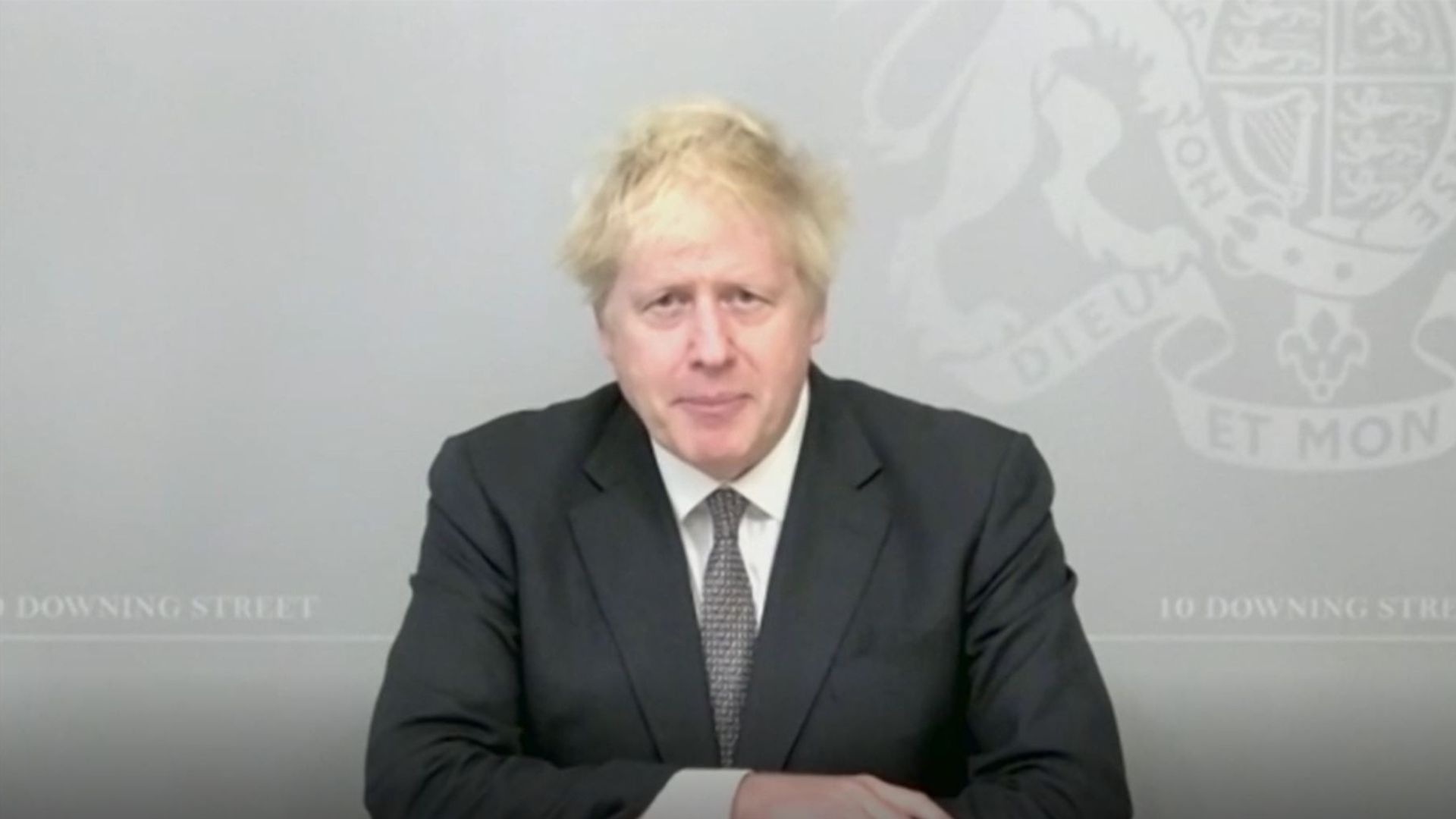 Prime minister Boris Johnson speaks via video link from 10 Downing Street during Prime Minister's Questions in the House of Commons, London - Credit: PA