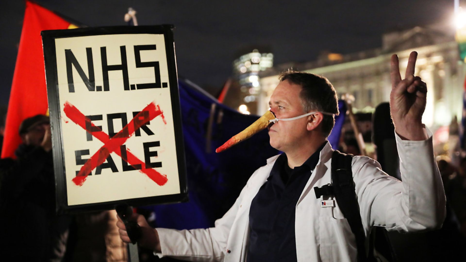 NHS nurses and doctors protest outside Buckingham Palace during Trump's NATO visit. Recently unearthed documents reportedly show US drug companies eyeing the UK market for price hikes. Picture: Isabel Infantes/PA Wire/PA Images - Credit: PA Wire/PA Images