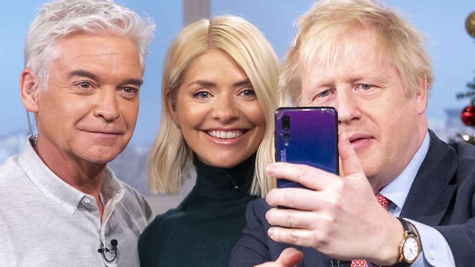 Phillip Schofield, Holly Willoughby and Boris Johnson using what appears to be a Huwaei phone for a selfie after the prime minister's interview on ITV's This Morning. Picture: ITV - Credit: ITV