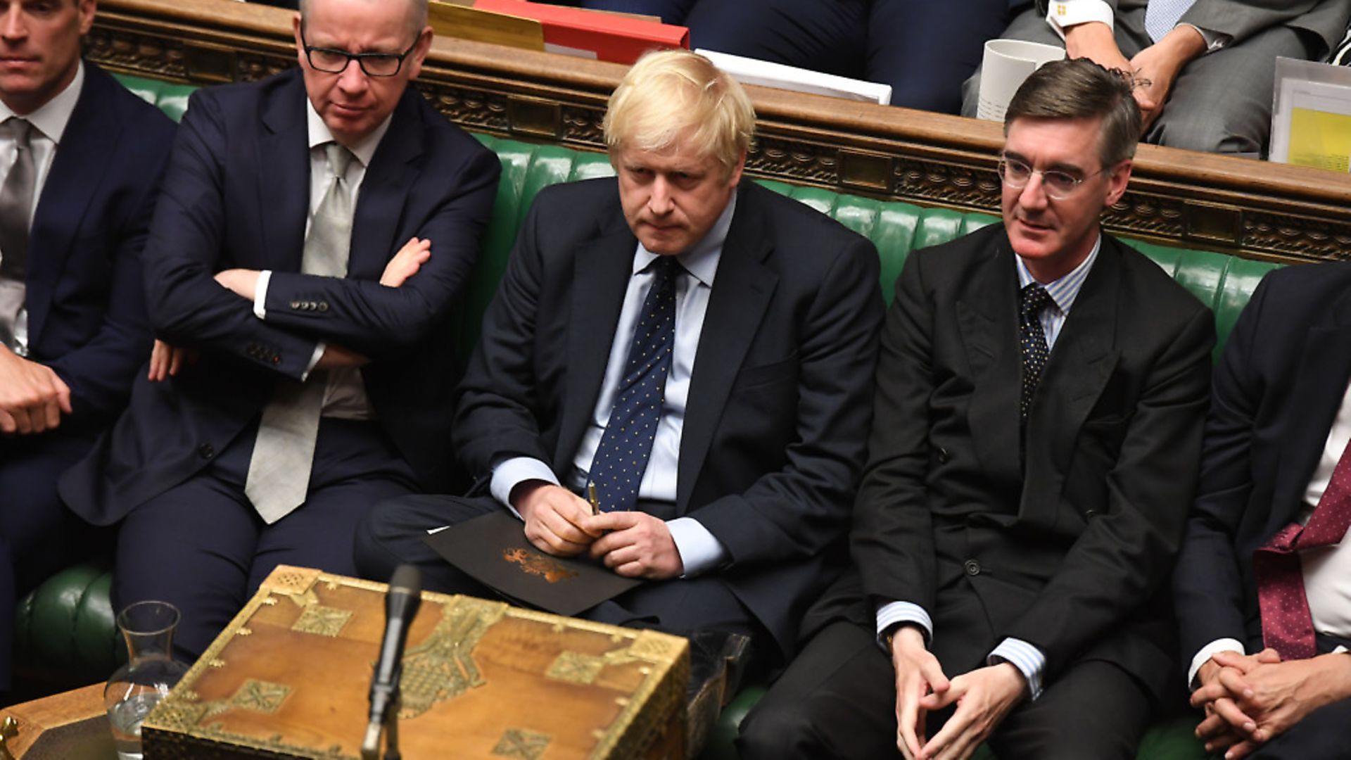 Boris Johnson (centre) in the House of Commons with Michael Gove and Jacob Rees-Mogg. Photograph: Jessica Taylor/UK Parliament/PA Wire. - Credit: PA